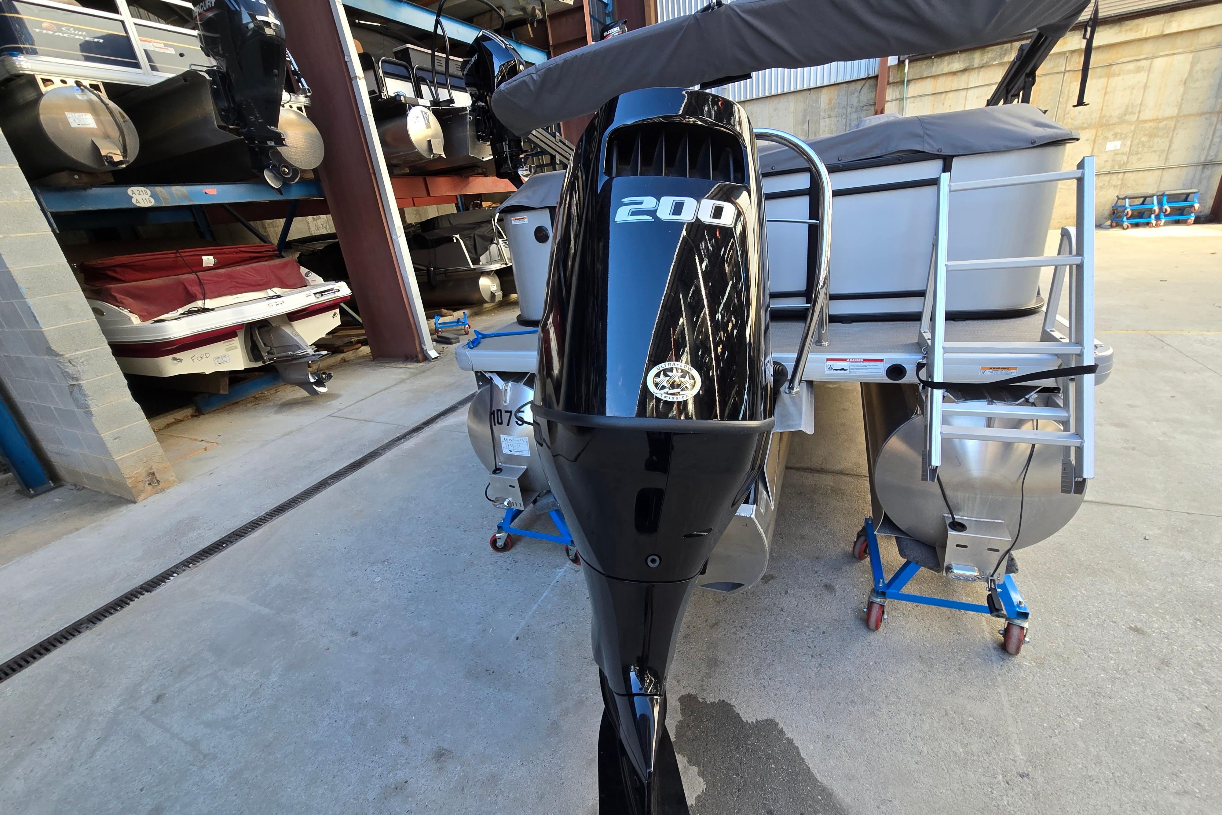 2024 Godfrey Sweetwater 2486 SB pontoon boat with a 200 HP outboard motor.