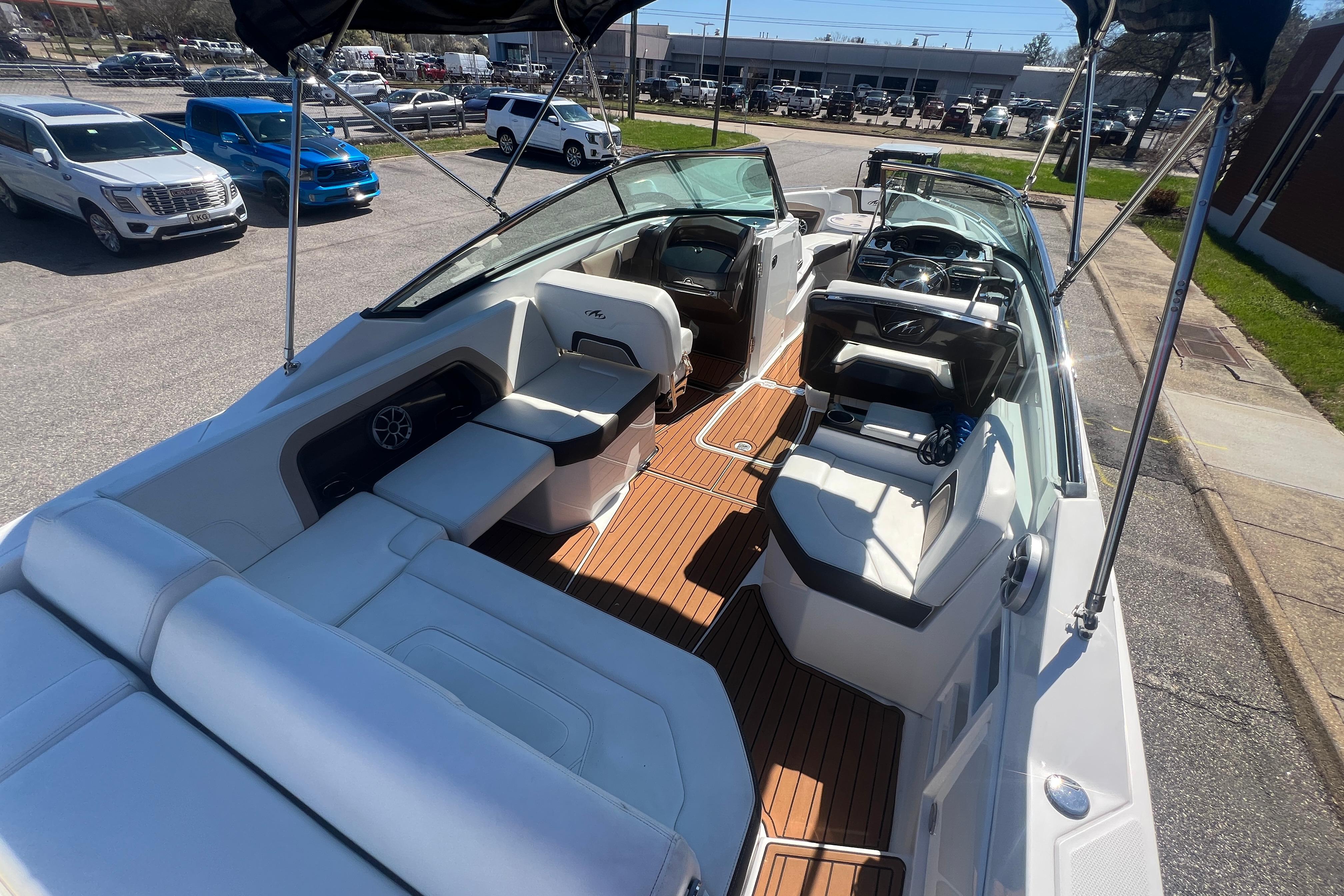 2017 Monterey 298SS Super Sport boat with spacious seating and sleek design in a parking lot.