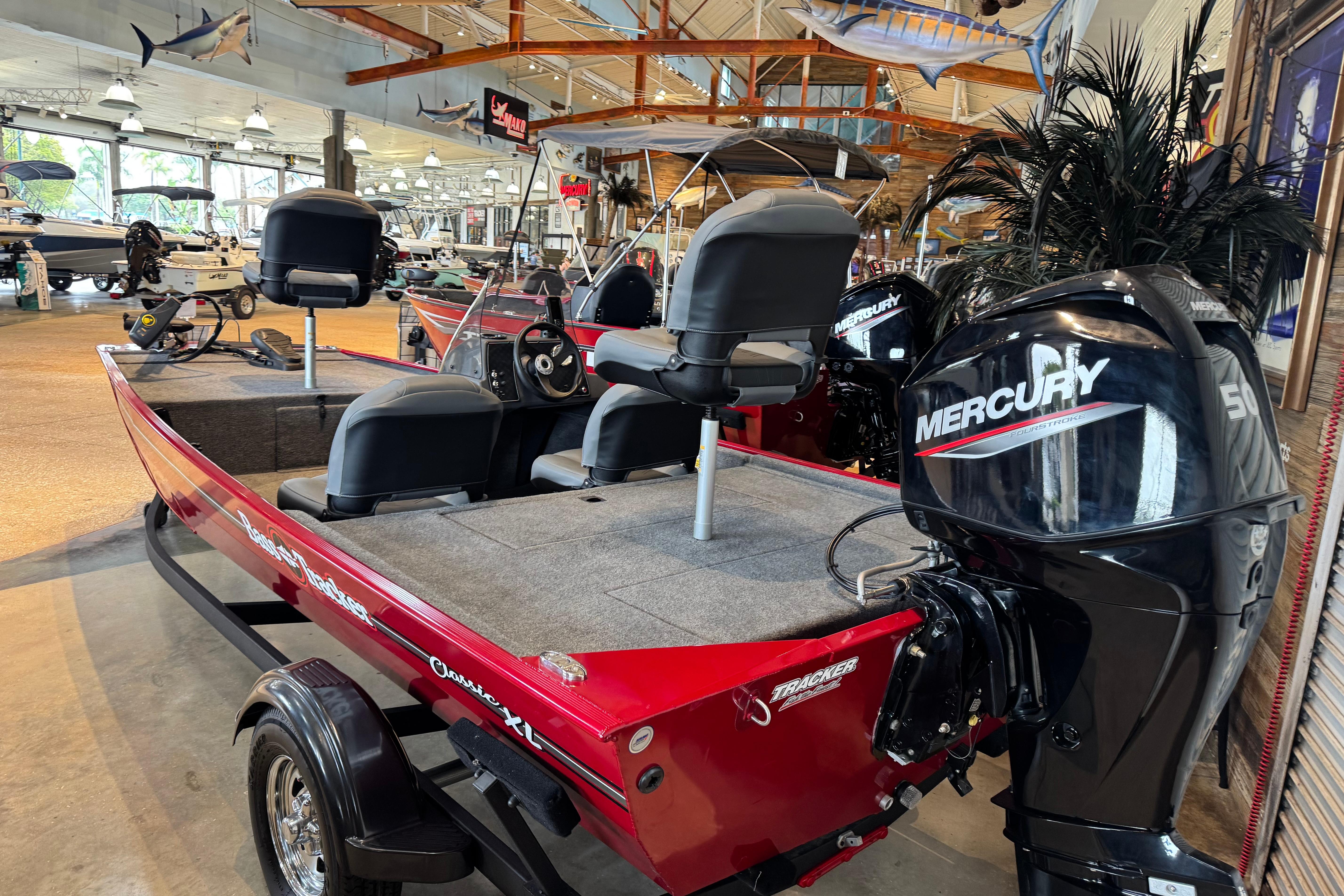 2025 Tracker Bass Tracker Classic XL boat with Mercury engine in showroom.