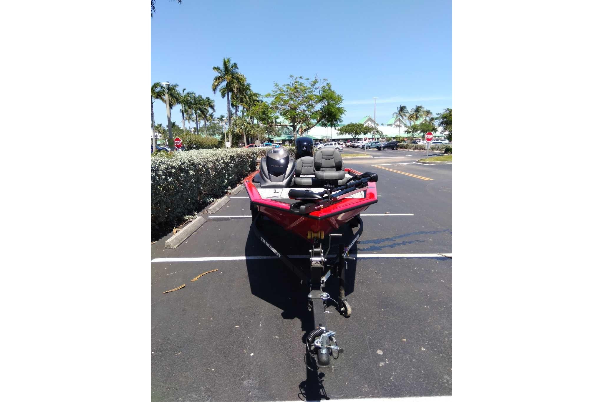 2026 Tracker Pro Team 175 Crappie Edition boat in parking lot, sunny day.