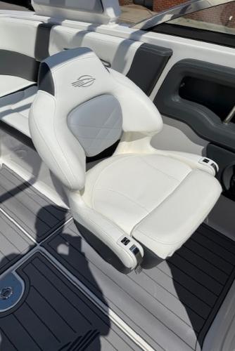 2023 Chaparral 267 SSX boat seat, white leather, modern design.