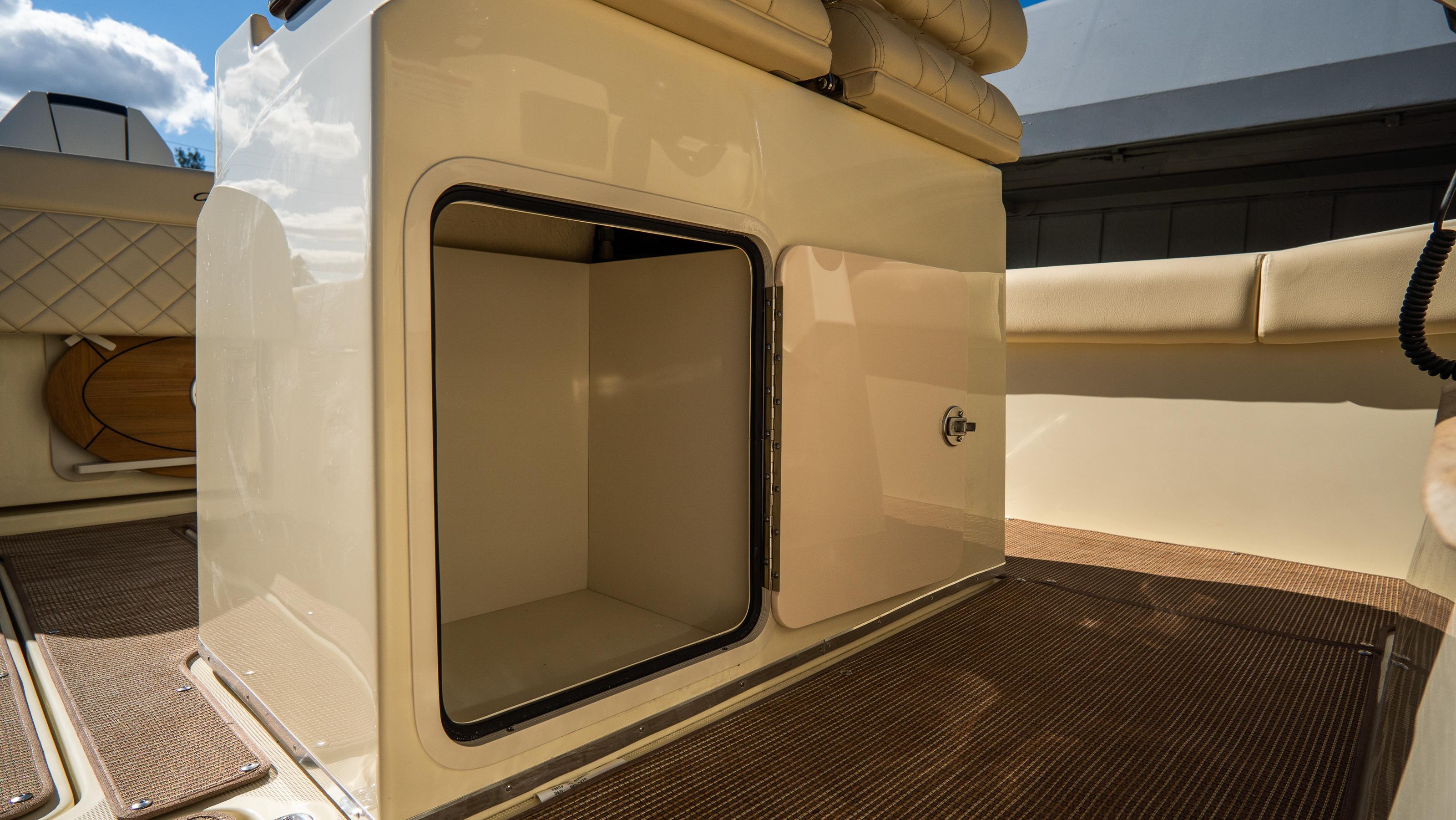 2025 Chris-Craft Catalina 30 interior storage compartment with cushioned seating.