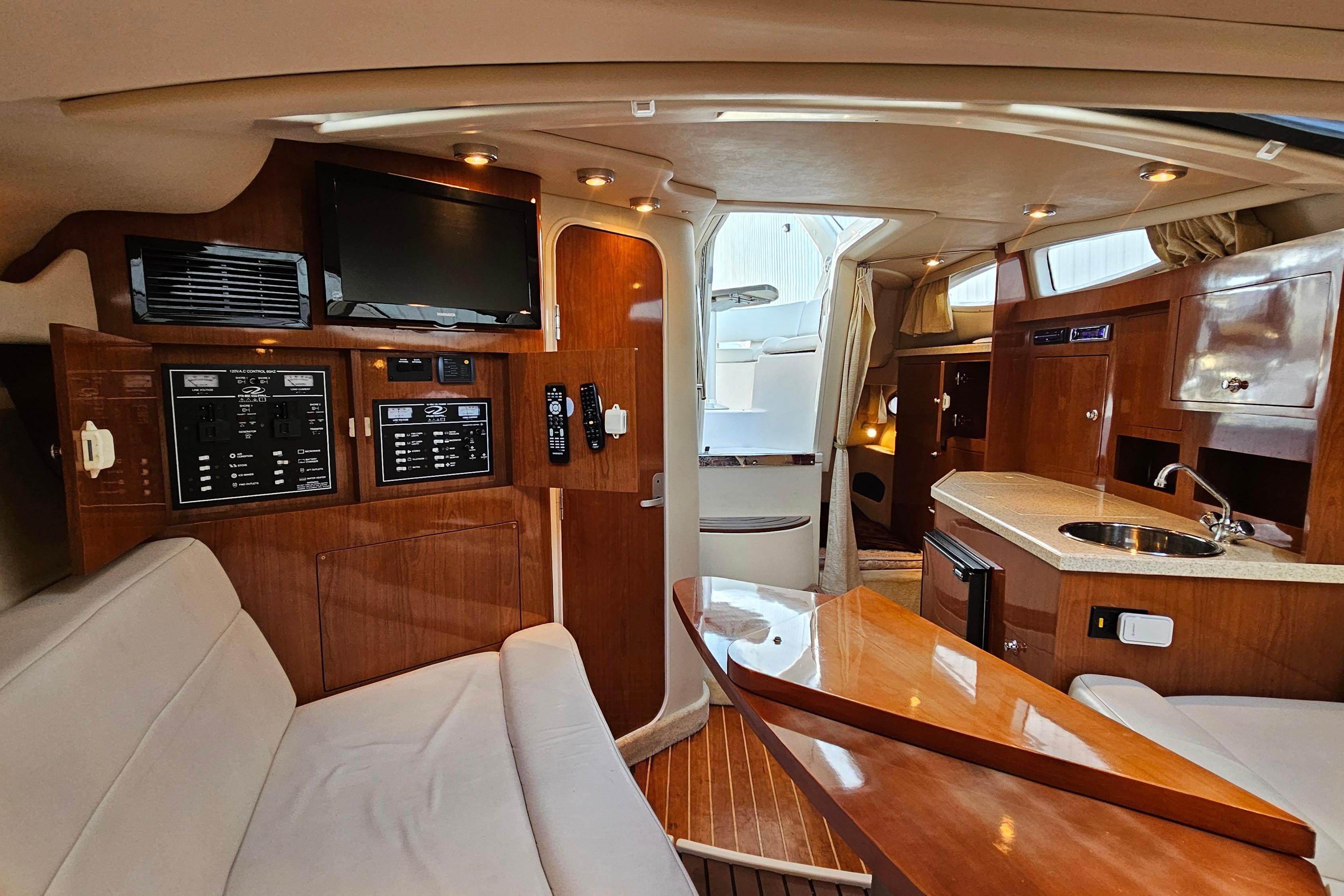 Interior of a 2005 Regal 3060 Window Express yacht with wood finishes and modern amenities.