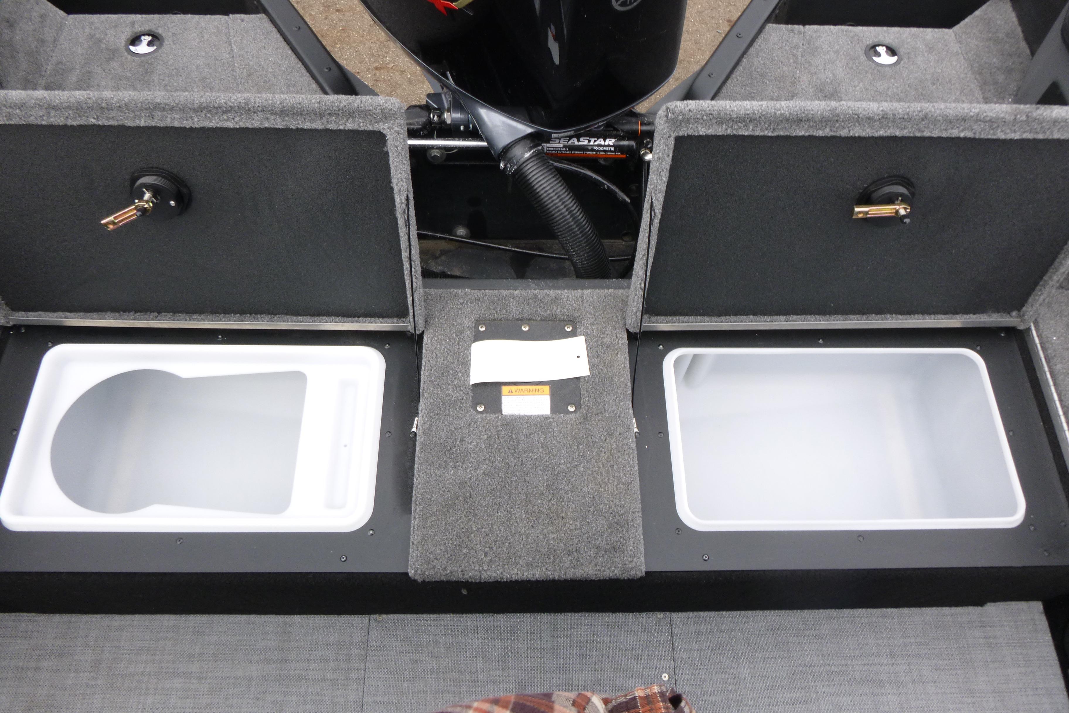2025 Alumacraft Trophy 185X Sport boat interior with storage compartments open.