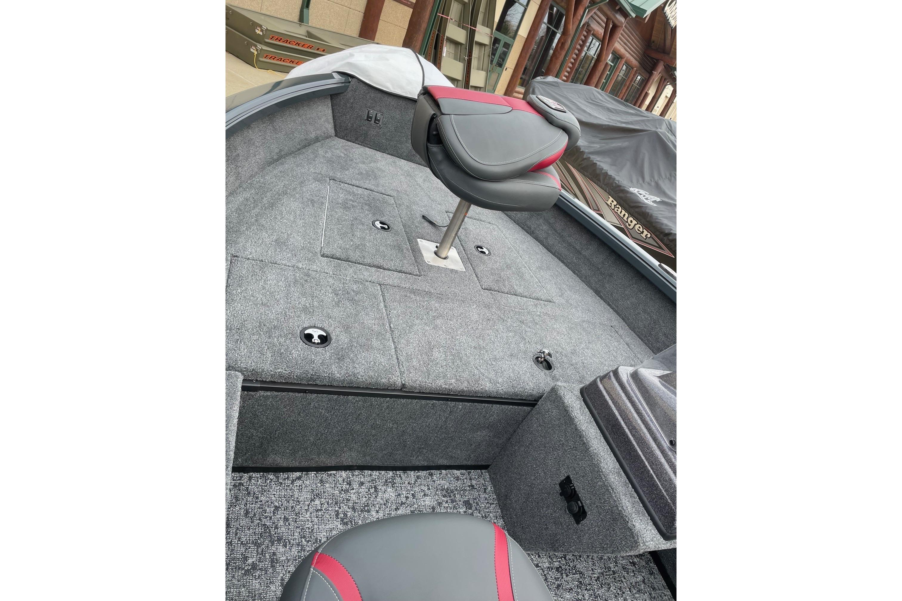 2026 Ranger VS1665SC boat interior with gray carpet and red-accented seat.