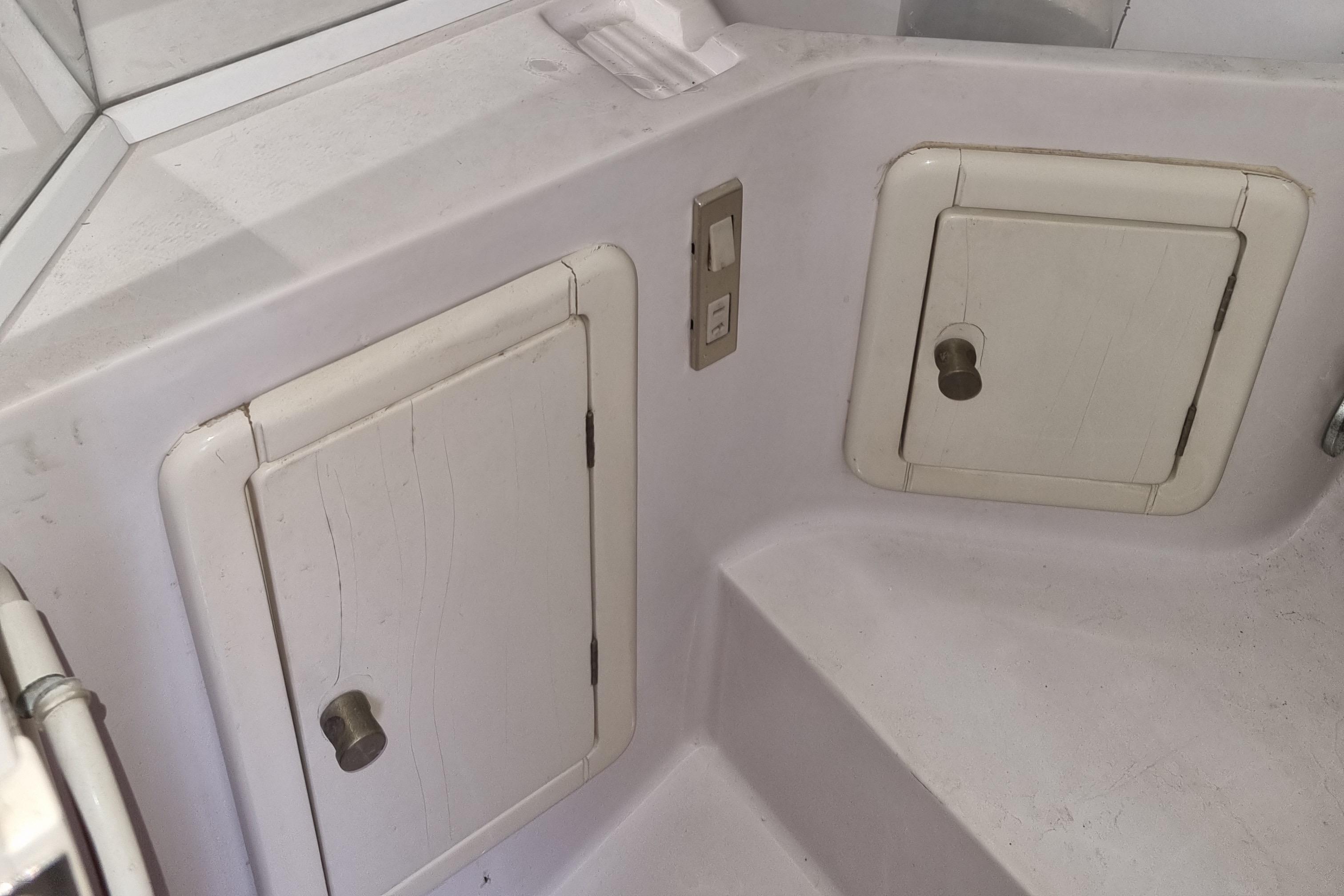 Interior view of a 1991 Tullio Abbate Superiority 41 boat with storage compartments.