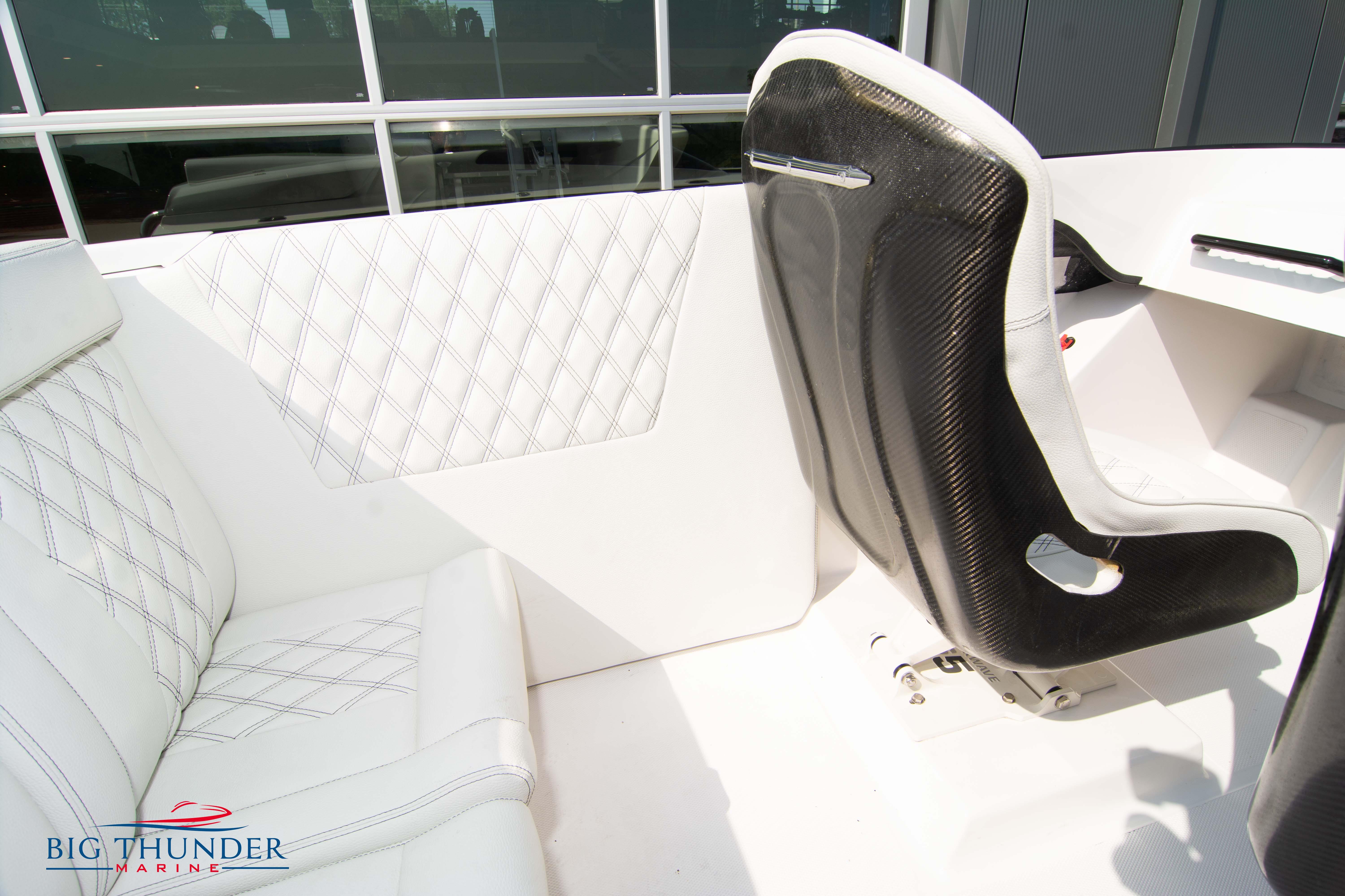 Interior of 2019 Spectre Screaming Eagle 22 Talon boat with white leather seats.