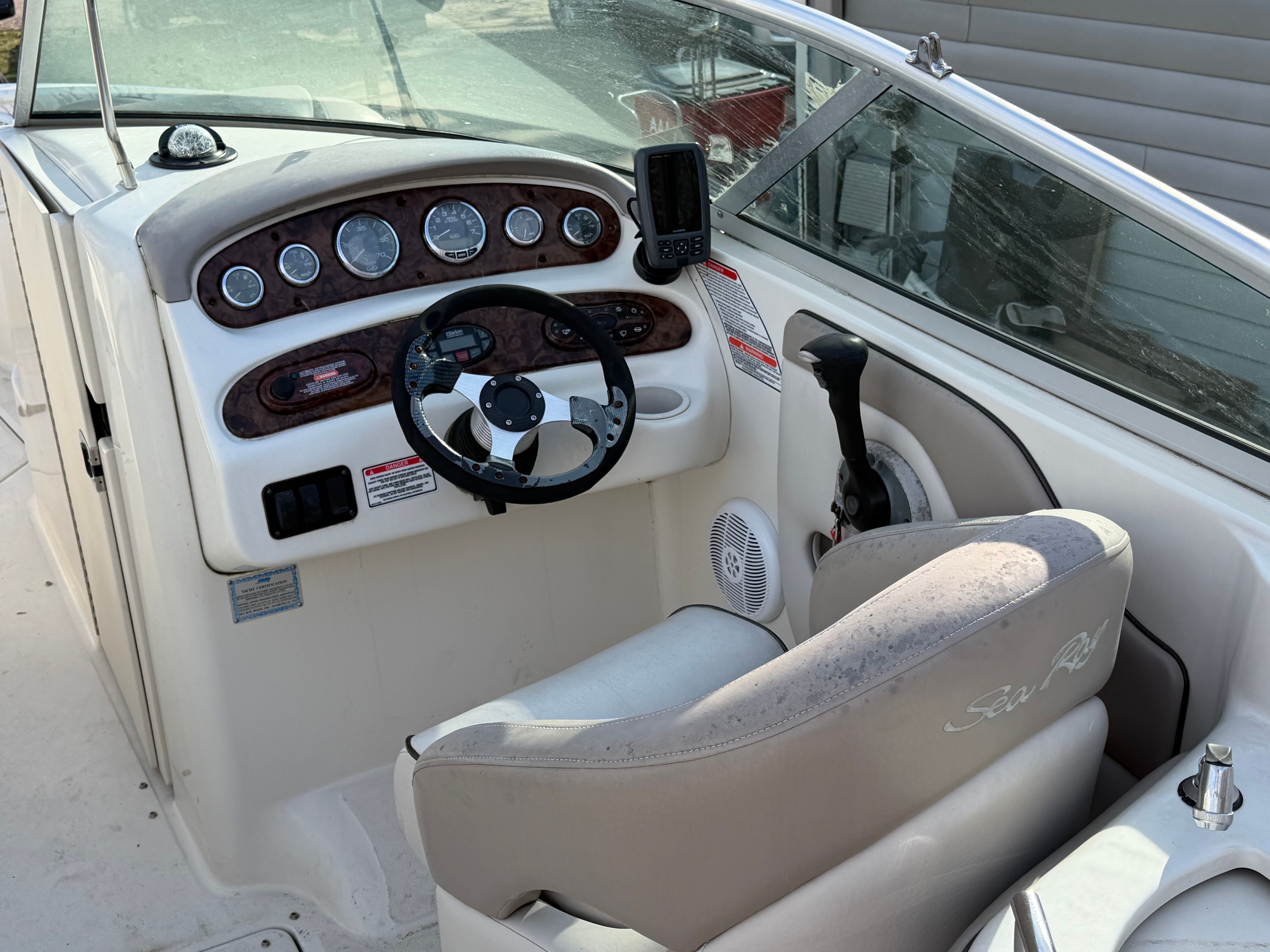 Cockpit of a 2004 Sea Ray 270 Sundeck boat with dashboard.