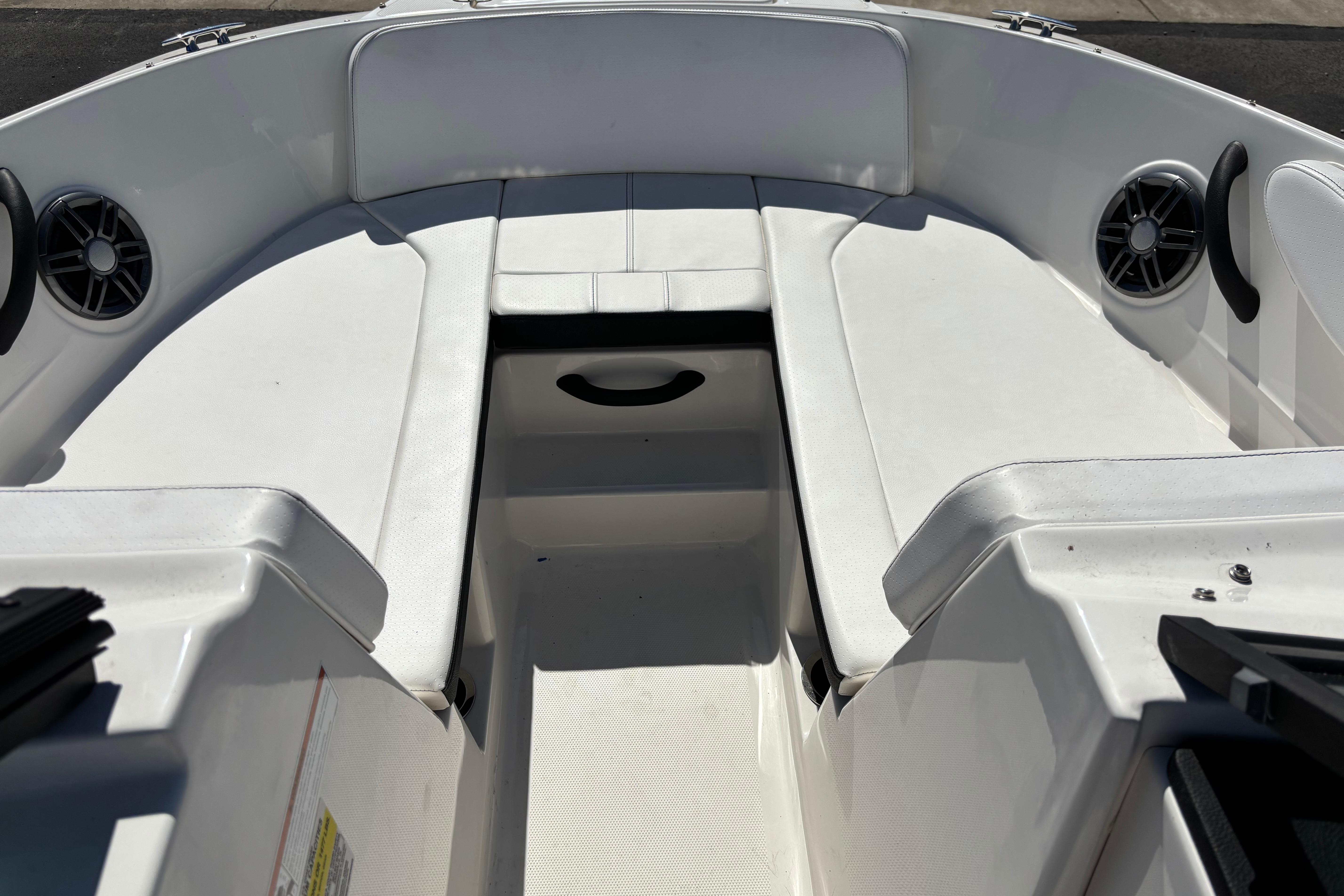 2022 Sea Ray SPX 190 Outboard boat interior with white seating and speakers.