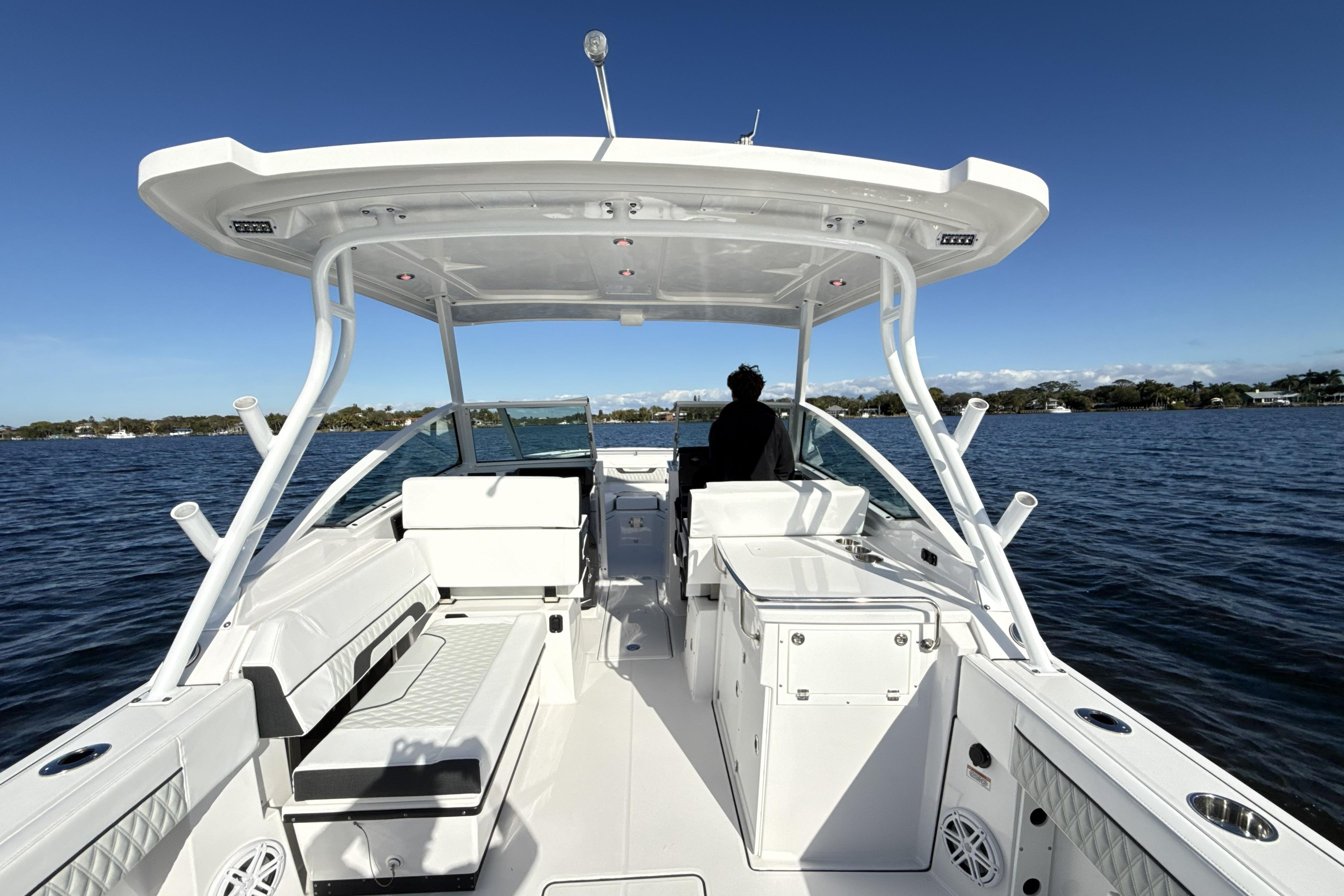 2025 Blackfin 272 DC boat cruising on a sunny day, featuring spacious seating and modern design.