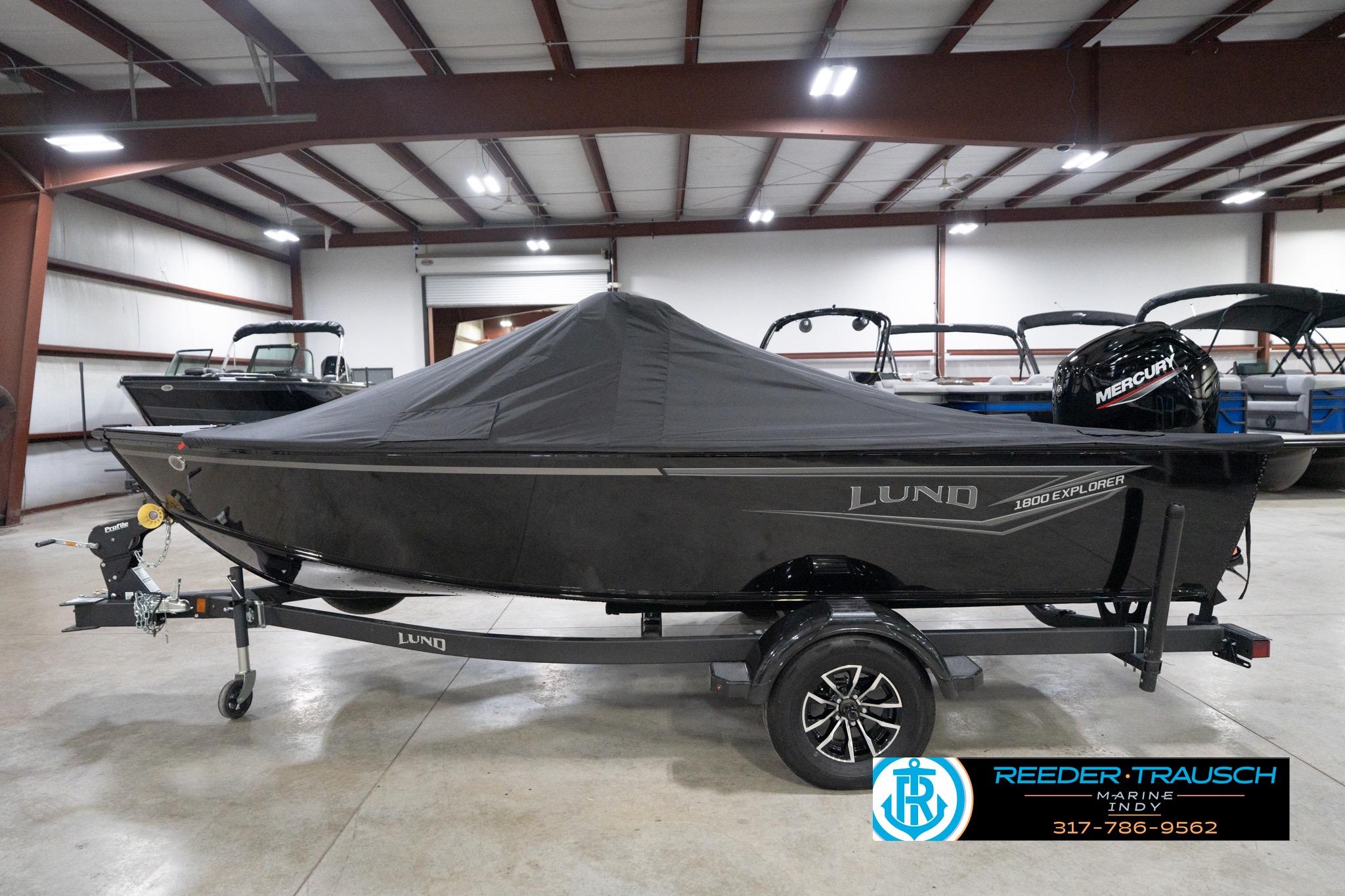 2026 Lund 1800 Explorer Sport boat with cover in indoor showroom.
