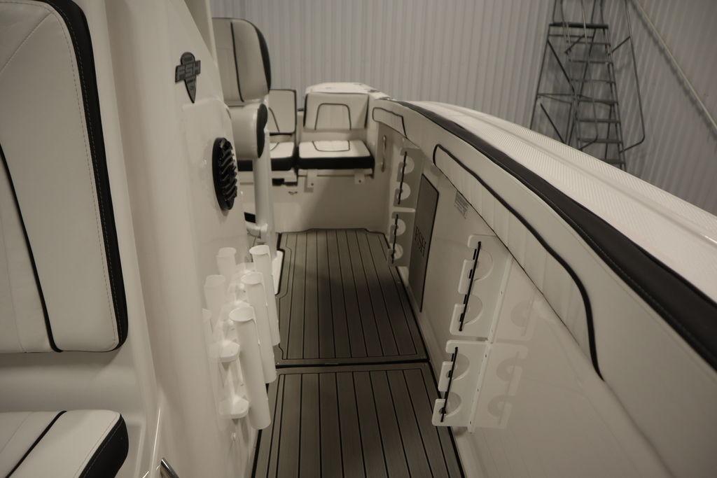 2026 Yamaha Boats 255 FSH Sport E interior with seating and storage compartments.