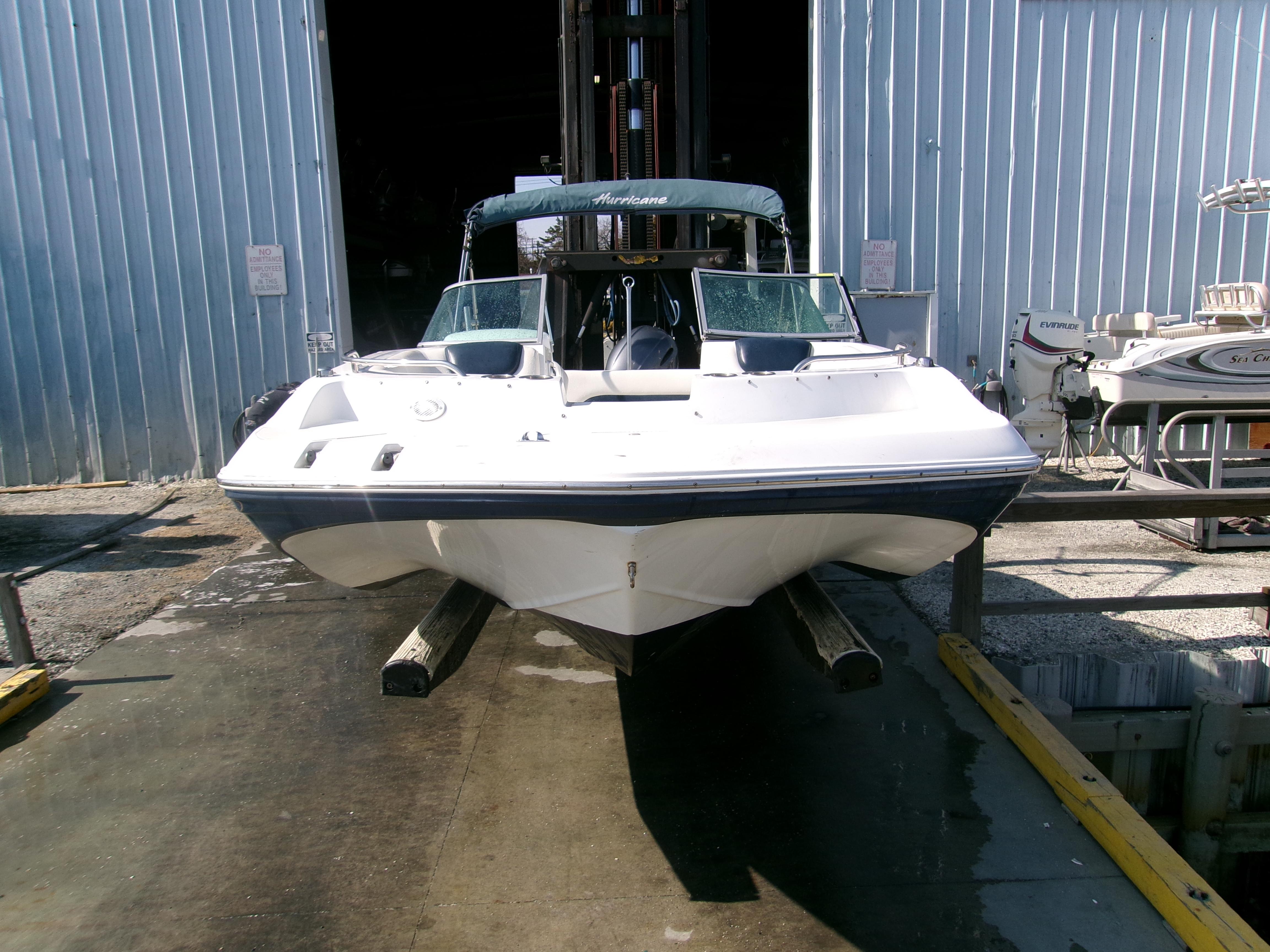 2016 Hurricane SunDeck 187 OB boat in storage facility.