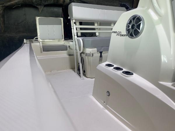2024 Mako Pro Skiff 19 CC interior view, featuring seating and storage compartments.