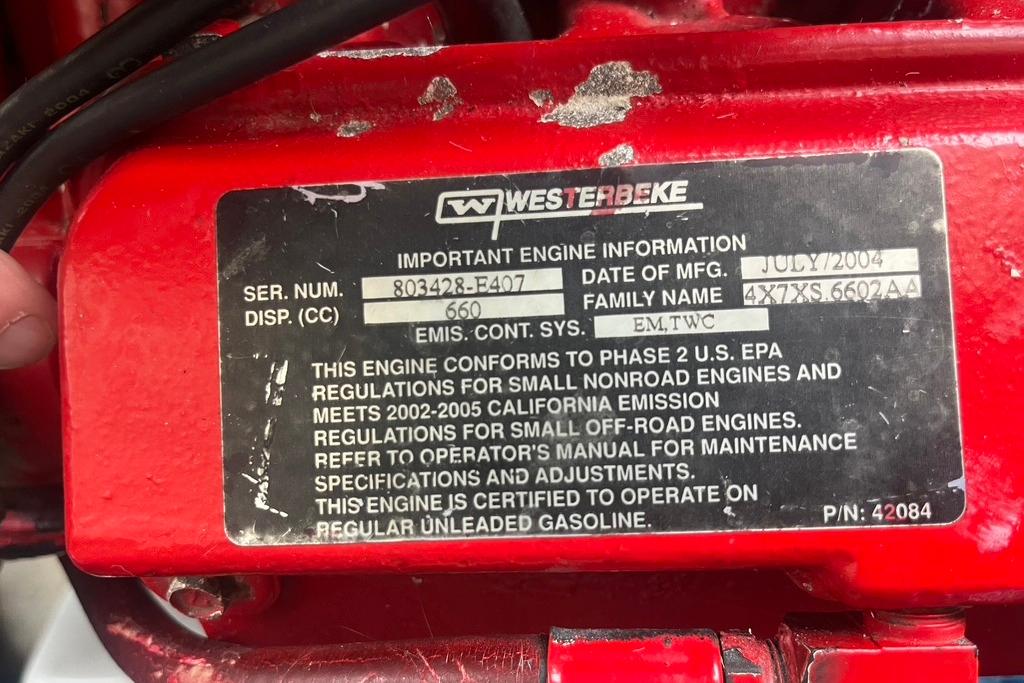 Westerbeke engine label on a 2005 Pursuit 3100 Offshore boat, showing specifications and compliance details.