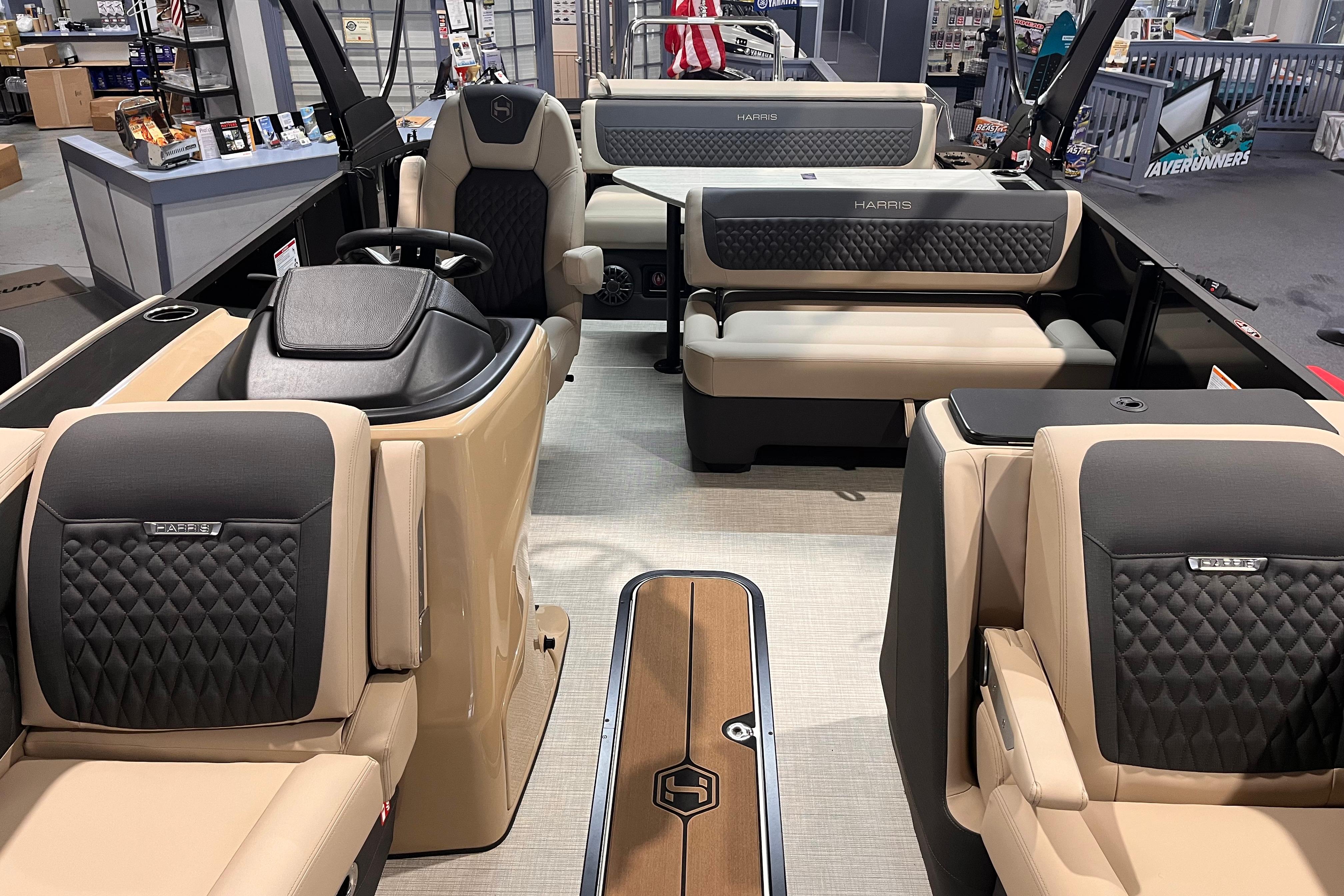 Luxurious interior of 2026 Harris Sunliner 250 pontoon boat with plush seating and modern design.