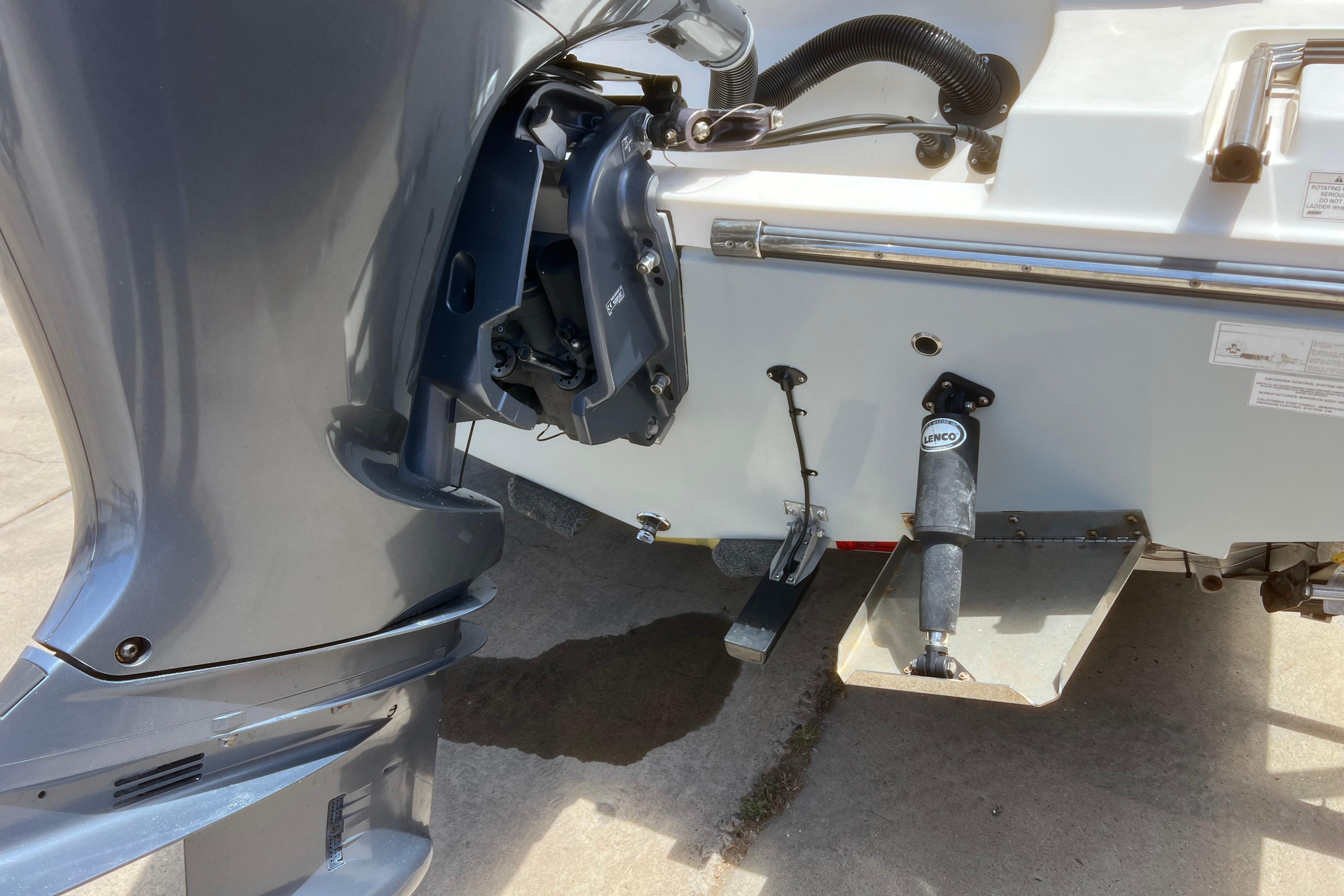 2018 Cobia 201 Center Console boat with outboard motor and Lenco trim tab.