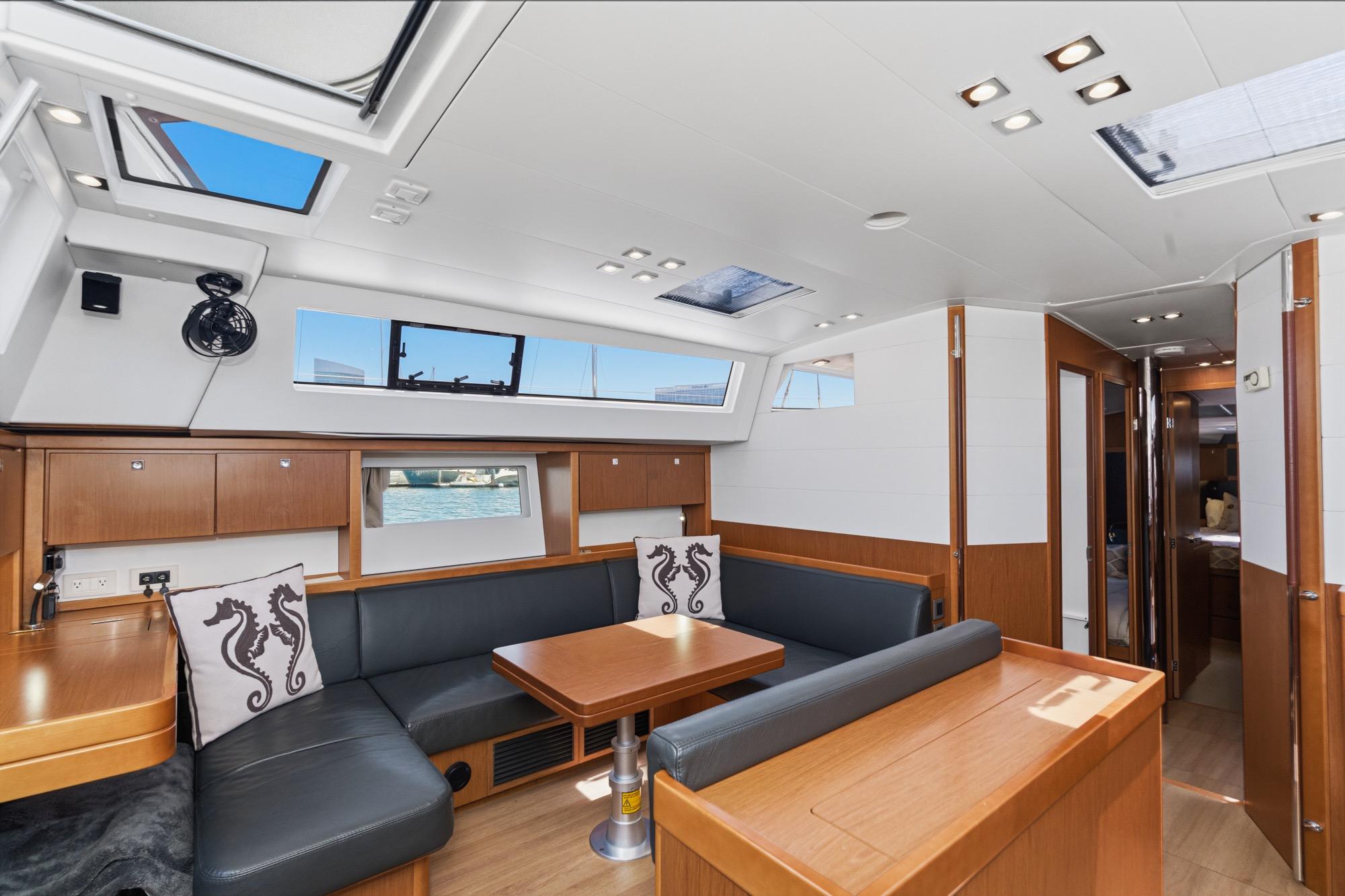 Luxurious interior of 2017 Beneteau Sense 50 yacht with modern seating and decor.
