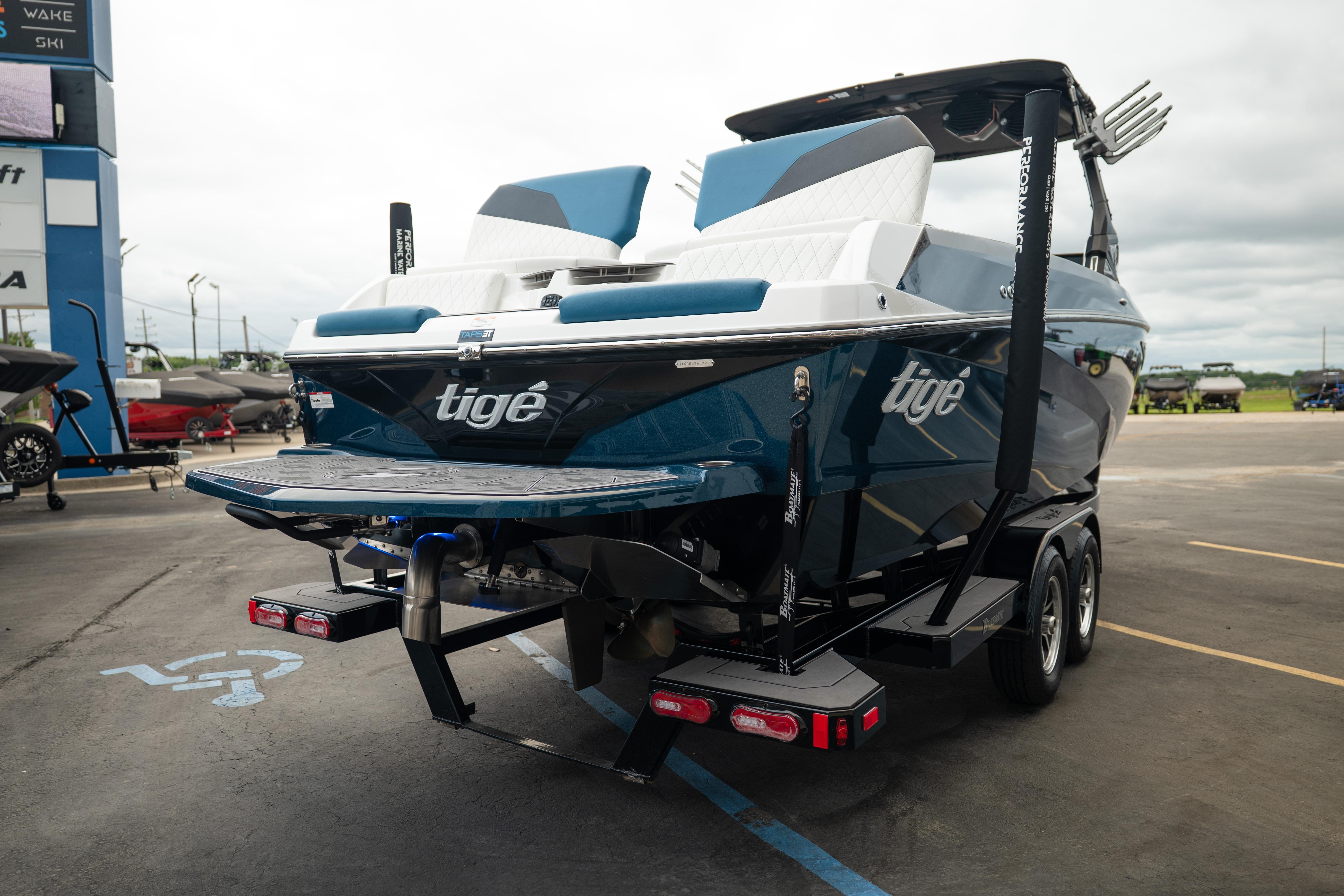 2024 Tigé Z5 boat on trailer, parked in a lot, rear view.