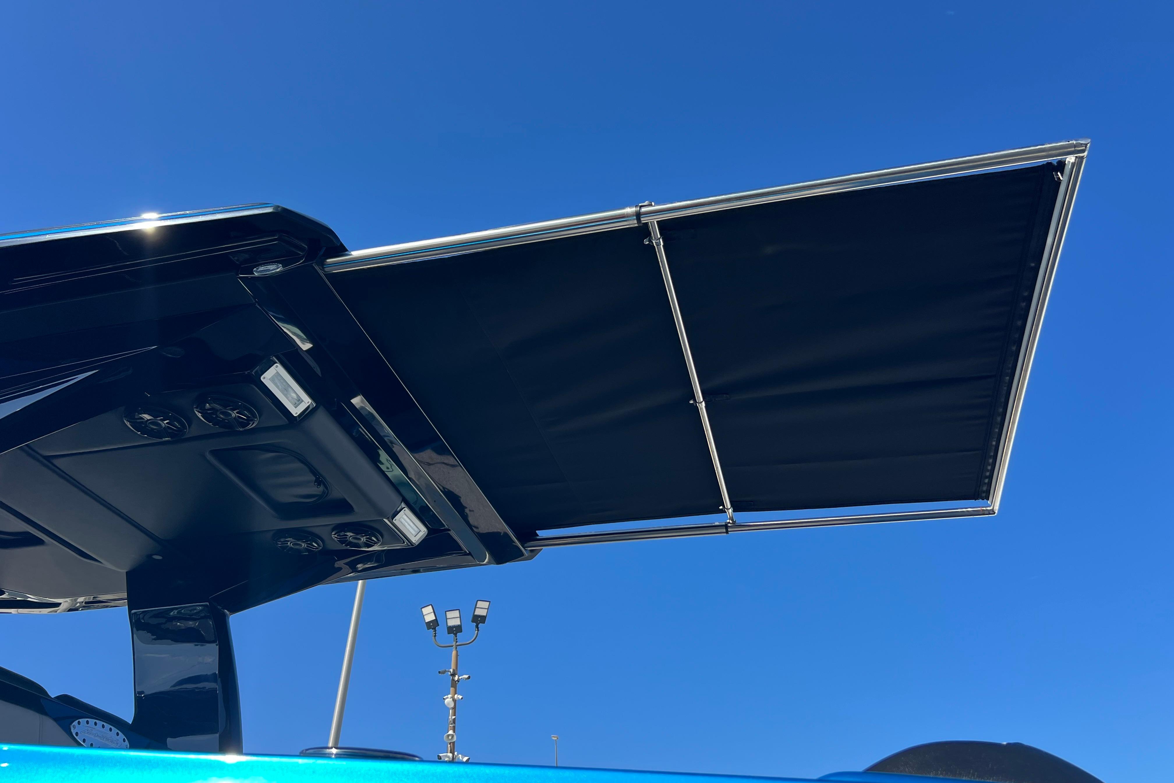 Nor-Tech 450 Sport 2026 boat canopy against clear blue sky.