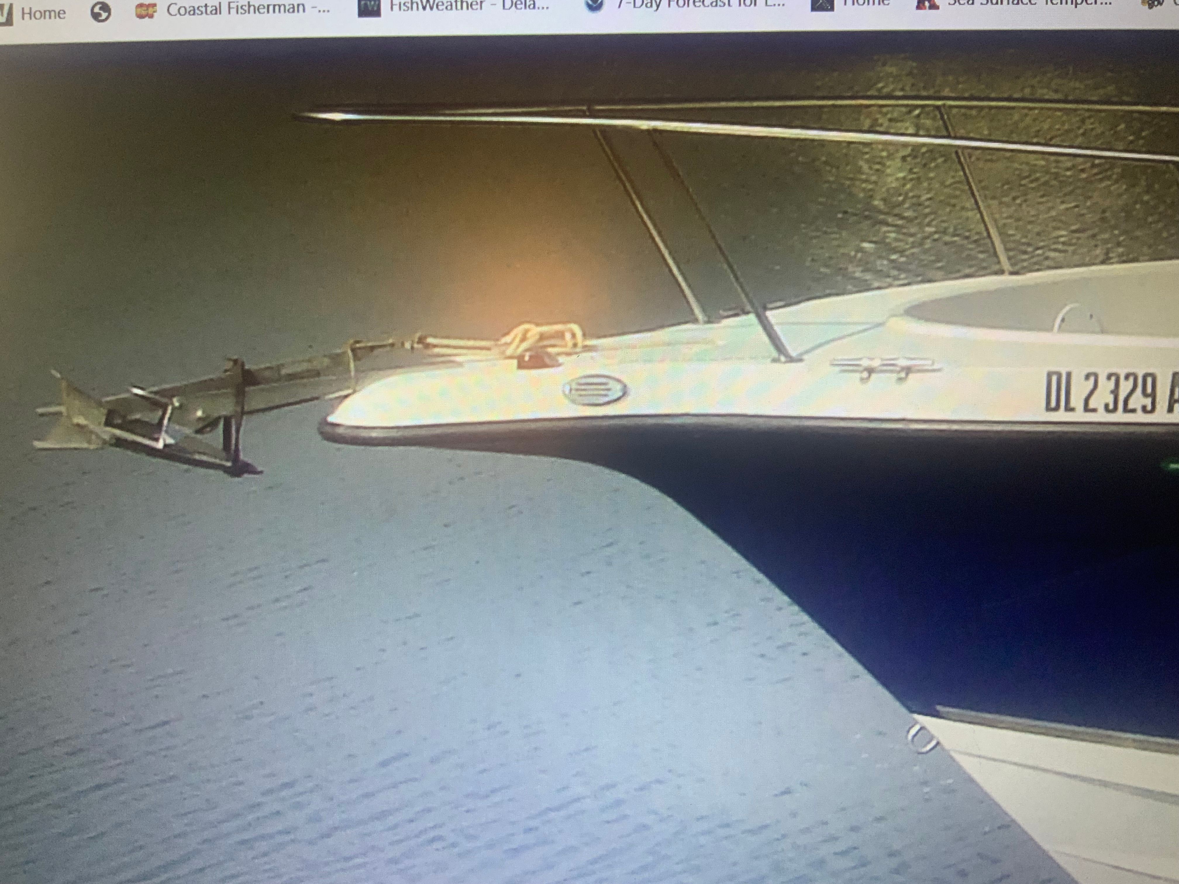 The 2006 Seaswirl Striper 26 is seen on calm water.