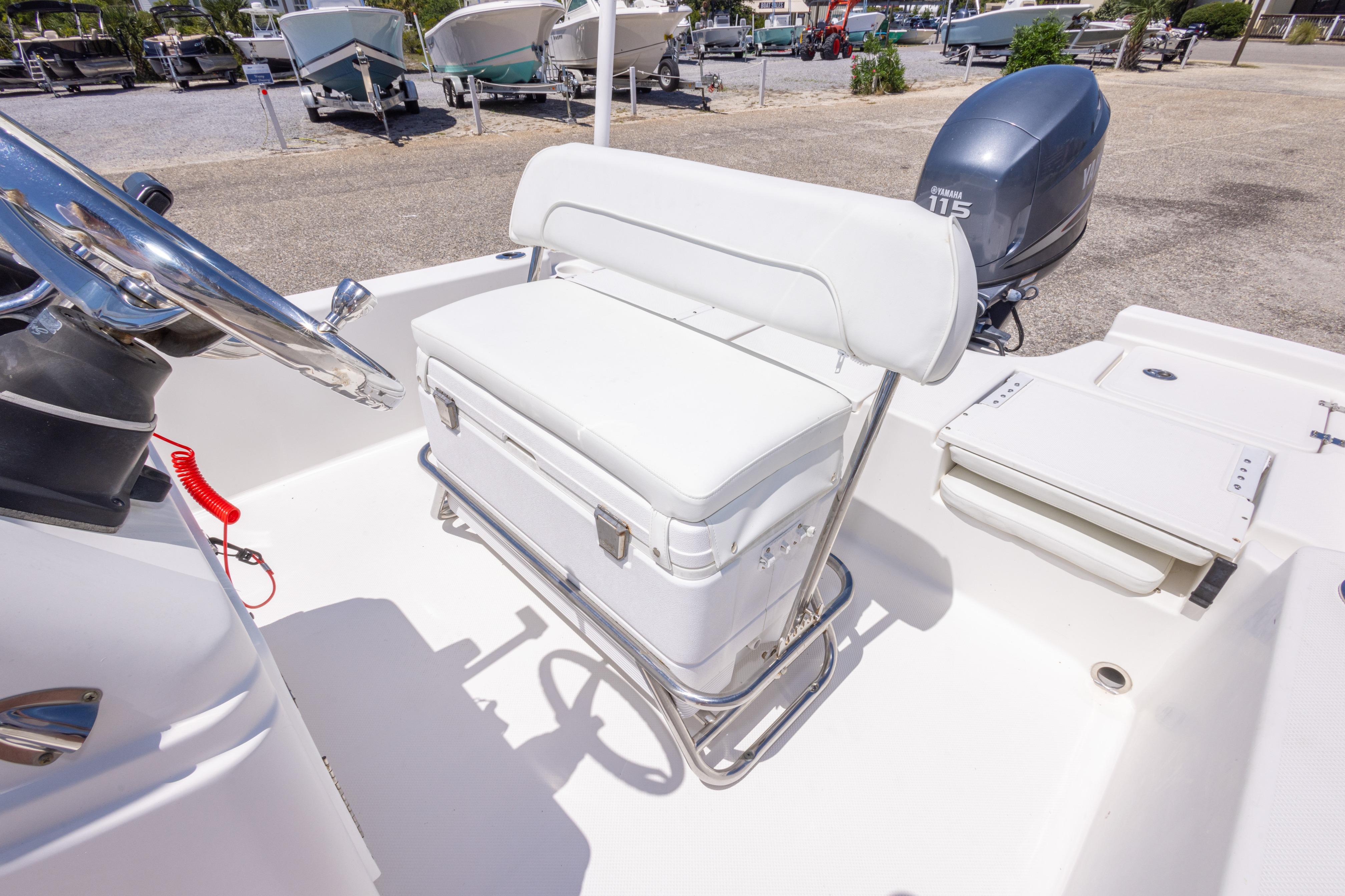 2011 Sea Fox 200XT boat interior with white seating and Yamaha 115 engine.