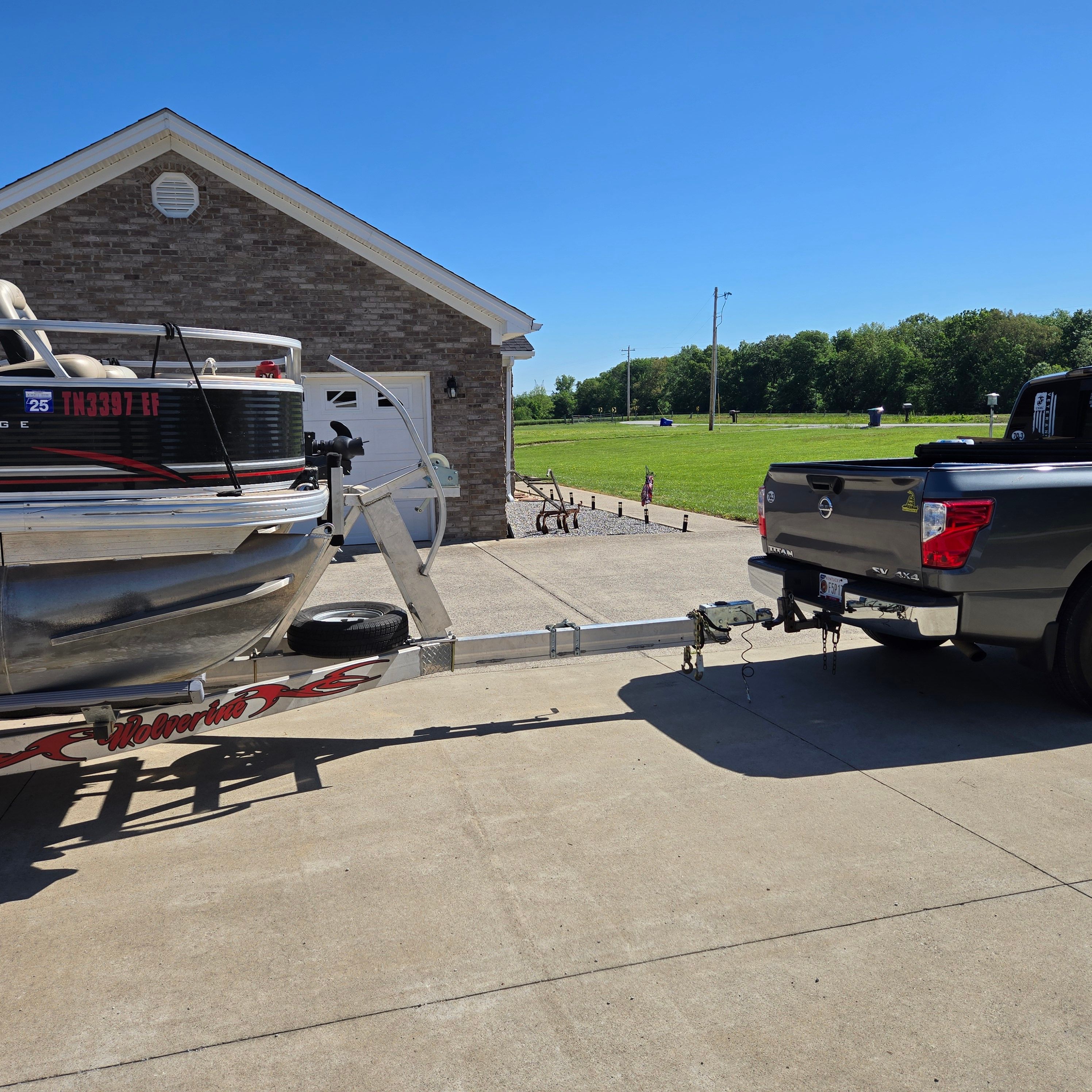 2012 Sun Tracker Fishin' Barge 24 DLX on a trailer.