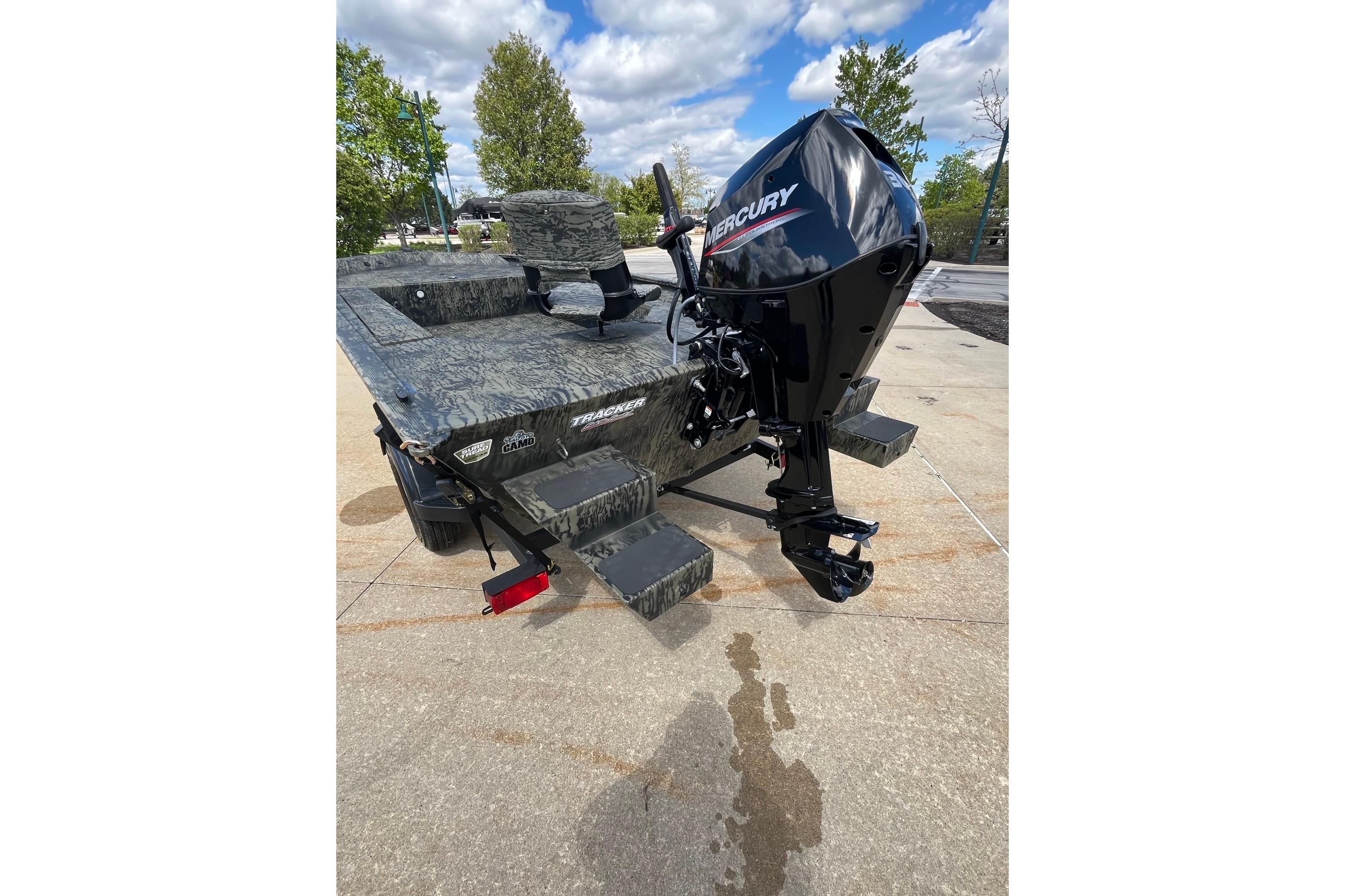 2026 Tracker Grizzly 1654 T Sportsman boat with Mercury engine on concrete surface.