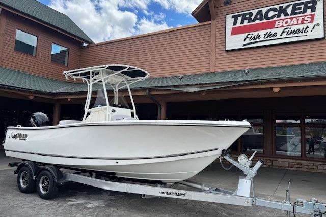 2026 Mako 214 Center Console boat on trailer at Tracker Boats dealership.