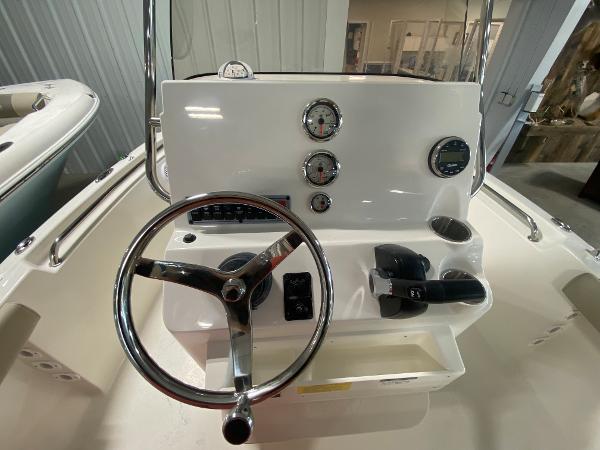 2024 Key West 189 FS boat console with steering wheel and gauges.