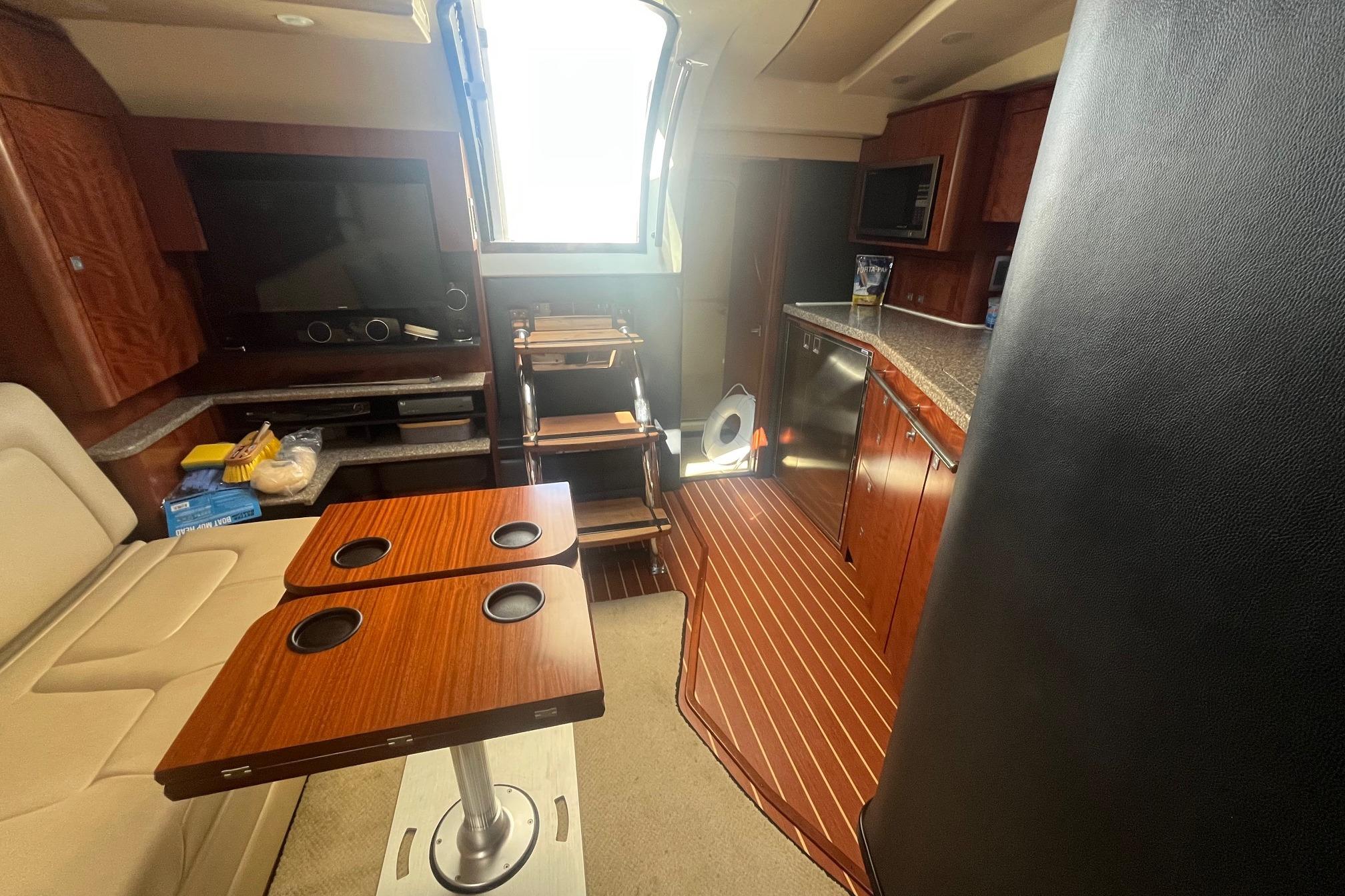 Interior of 2010 Monterey 400 Sport Yacht with wood accents and modern amenities.
