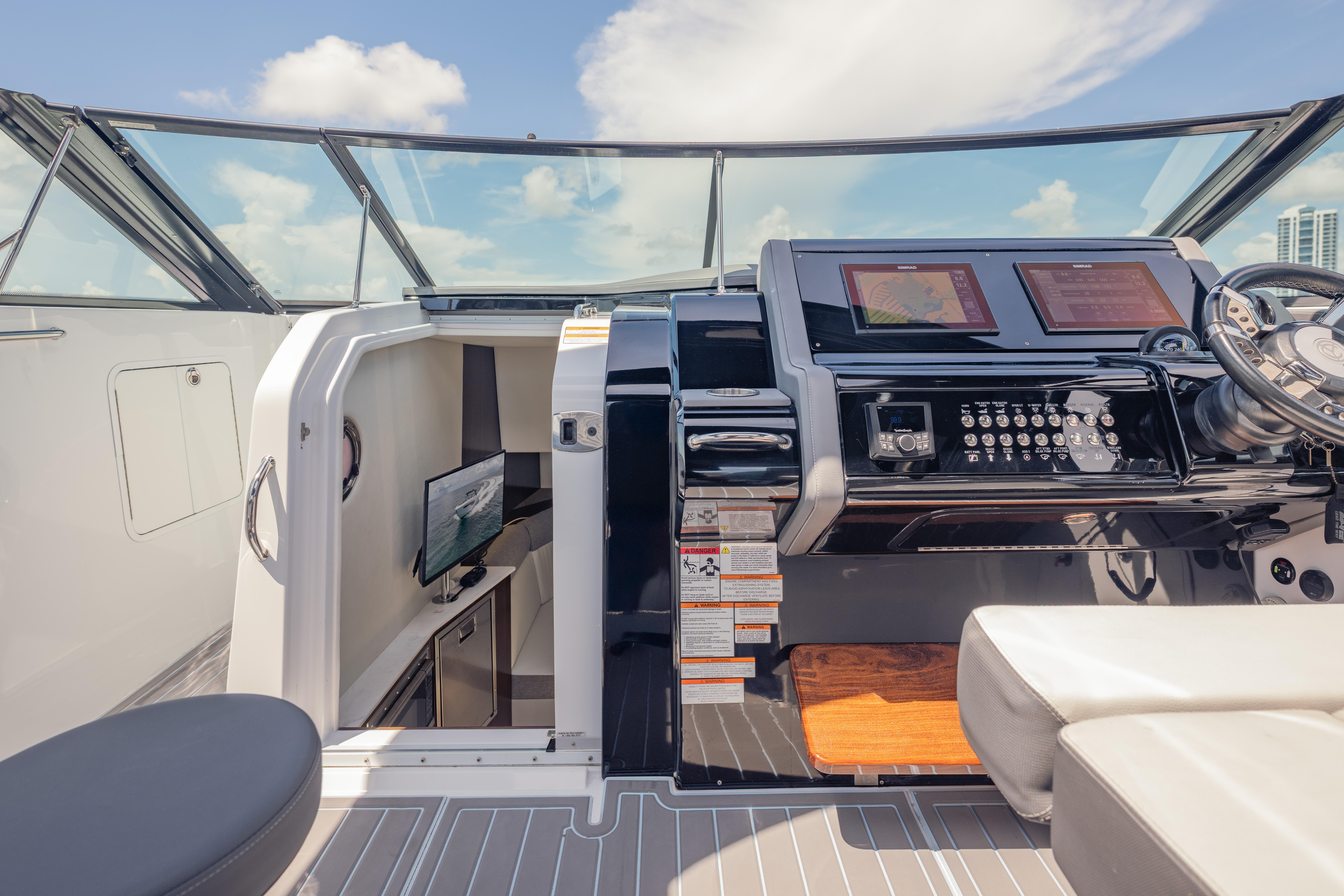 2021 Cruisers Yachts 38 GLS helm with modern controls and cabin view.