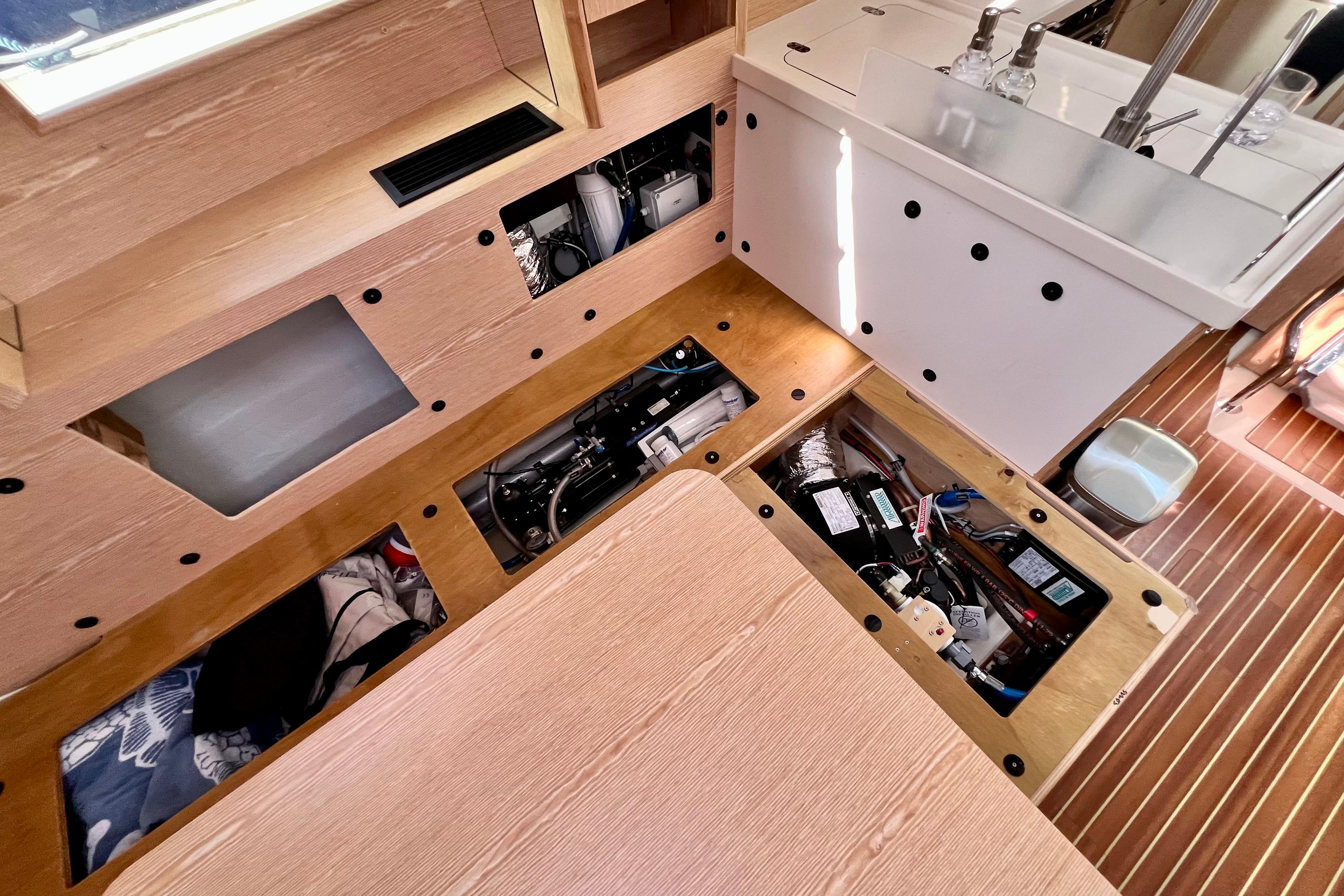 Interior view of a 2016 Hanse 455 yacht, showcasing underfloor storage compartments.