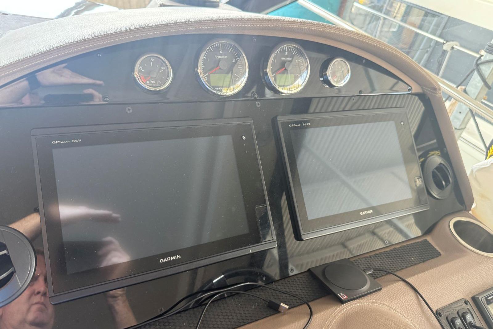 Dashboard of 2016 Regal 46 Sport Coupe with Garmin GPS displays and gauges.