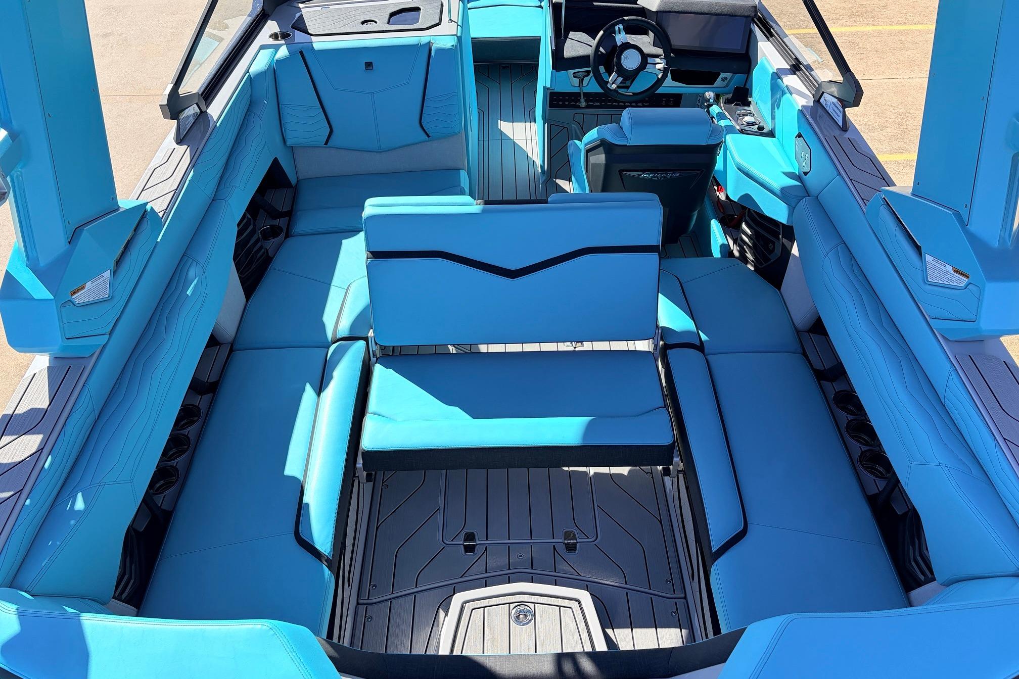 2026 Nautique Super Air Nautique G23 interior with blue seating and modern design.