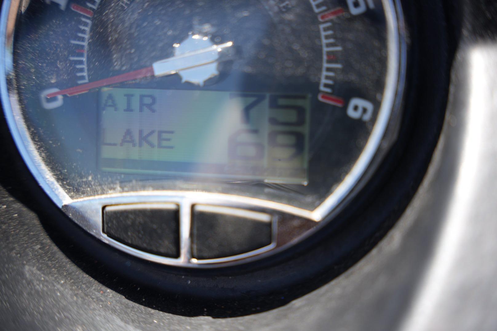 Close-up of a 2015 Axis A24 gauge displaying air and lake temperatures.