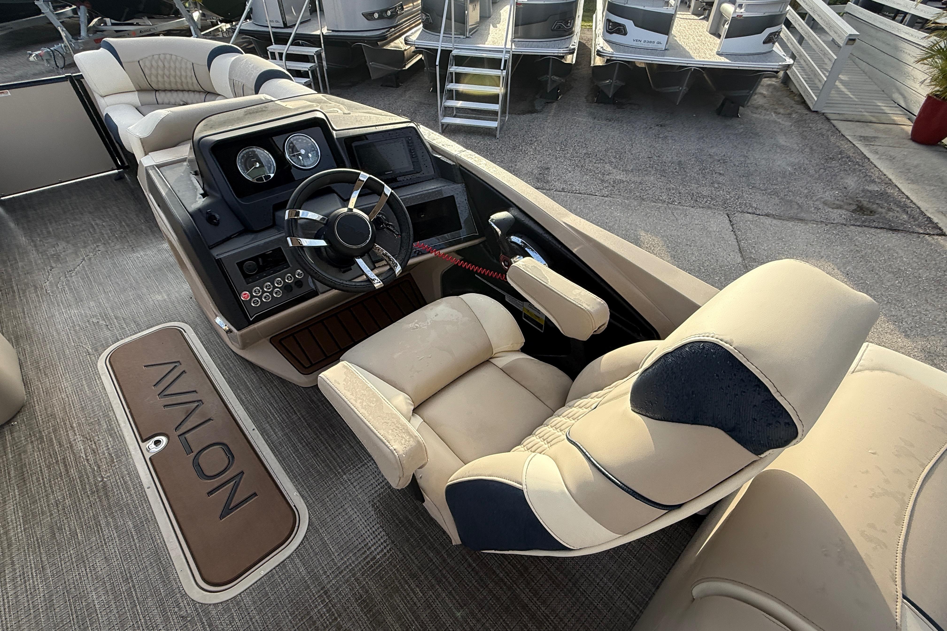 Interior of 2026 Avalon 2385 Catalina Quad Lounger, featuring luxurious seating and modern dashboard.