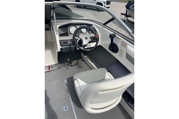 2013 Bayliner 190 Bowrider cockpit with steering wheel and dashboard controls.