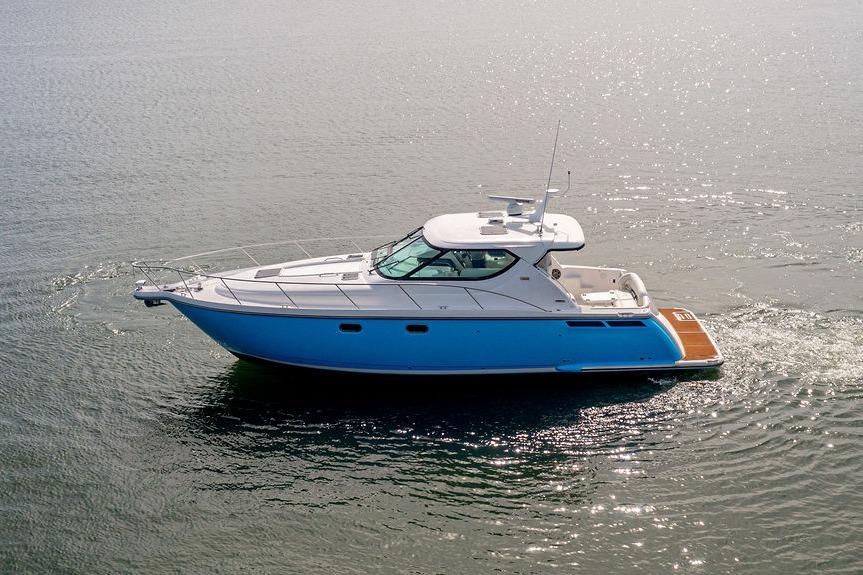 2006 Tiara Yachts 4300 Sovran cruising on calm waters.