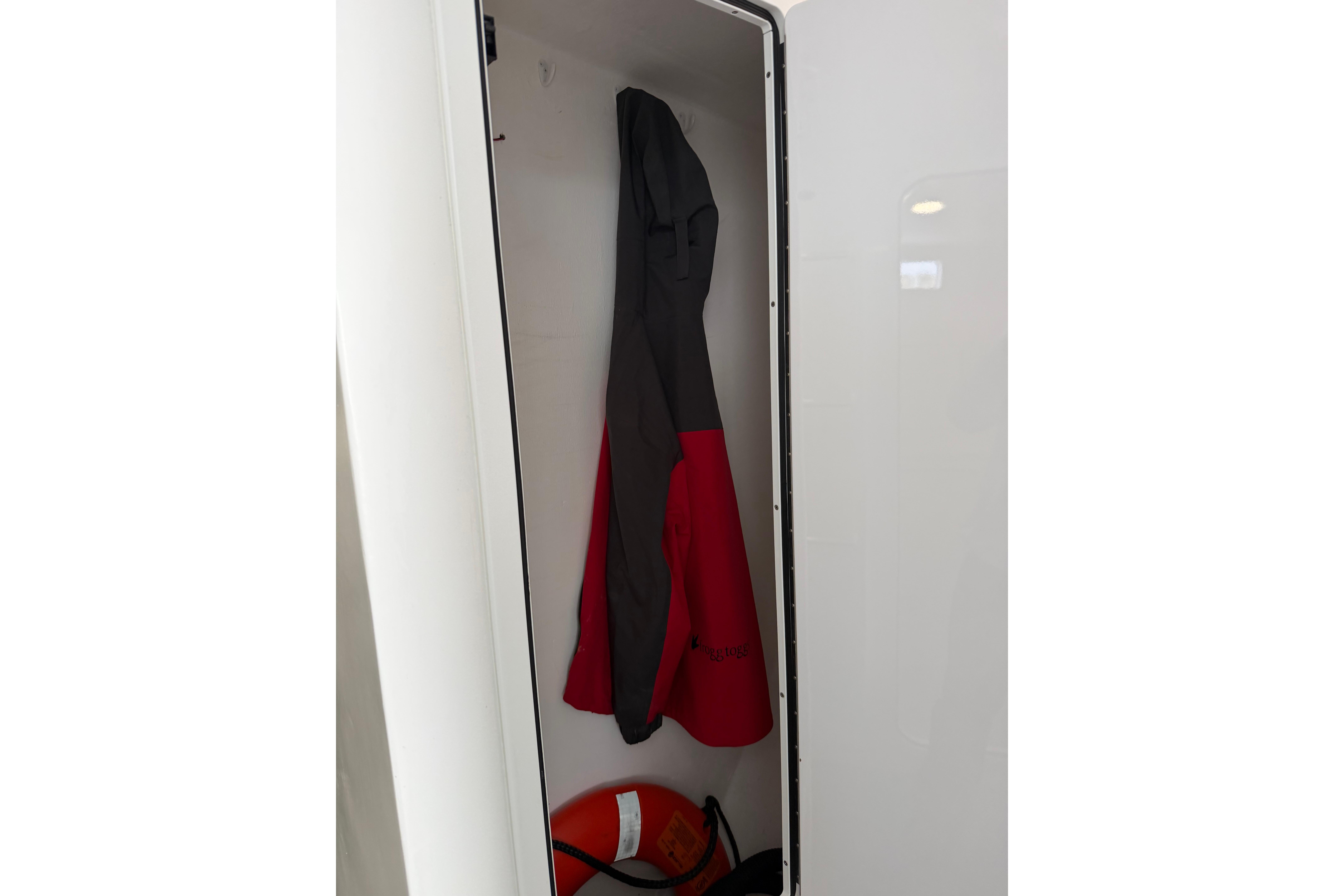 Coat hanging inside a 2018 H&H Marine Osmond Beal boat closet.