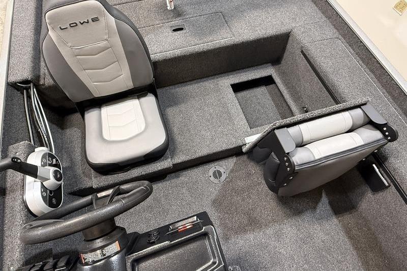 2026 Lowe Skorpion 16 boat interior with gray seating and steering console.