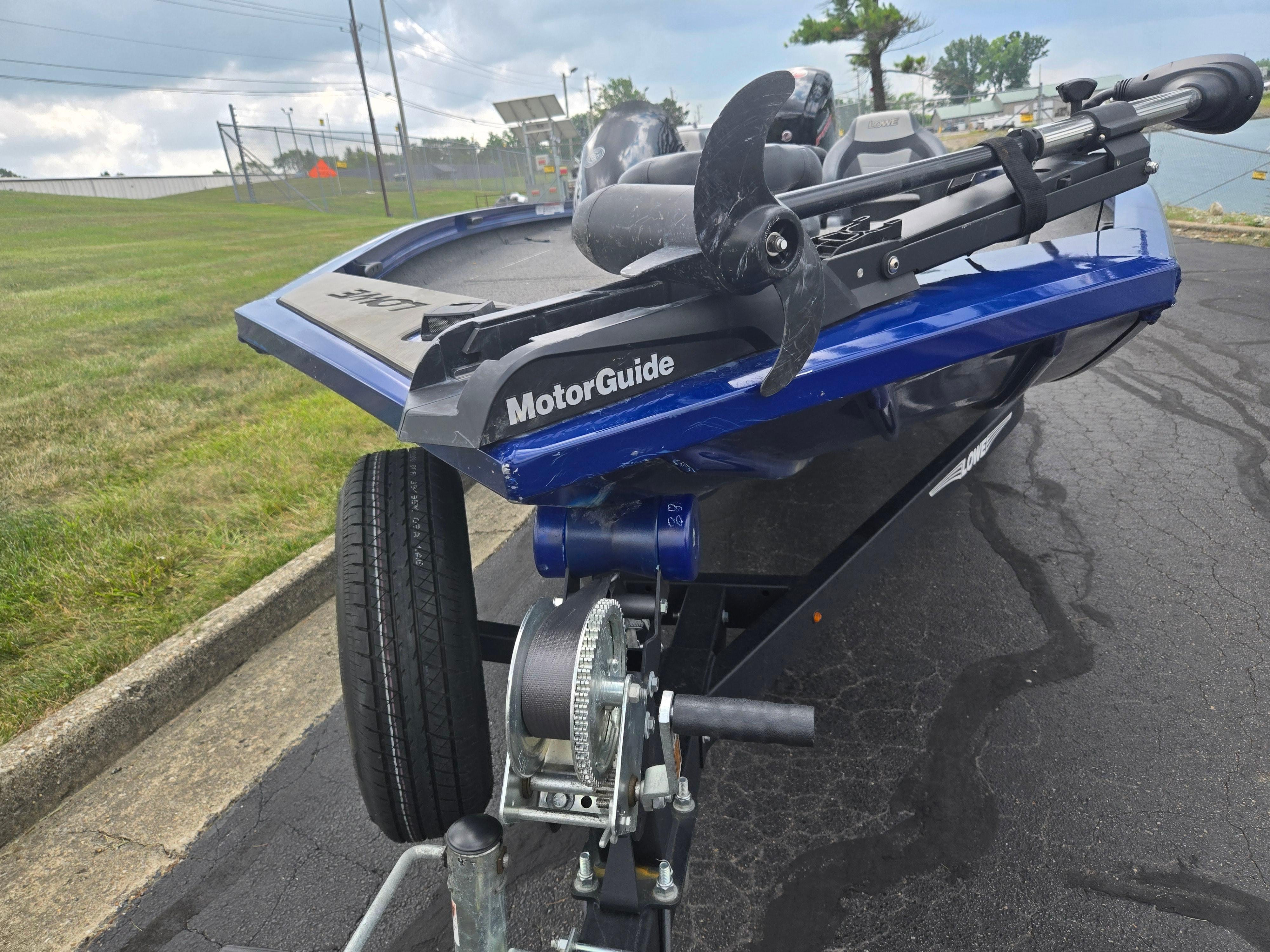 2021 Lowe Stinger 188 boat with MotorGuide trolling motor on trailer.