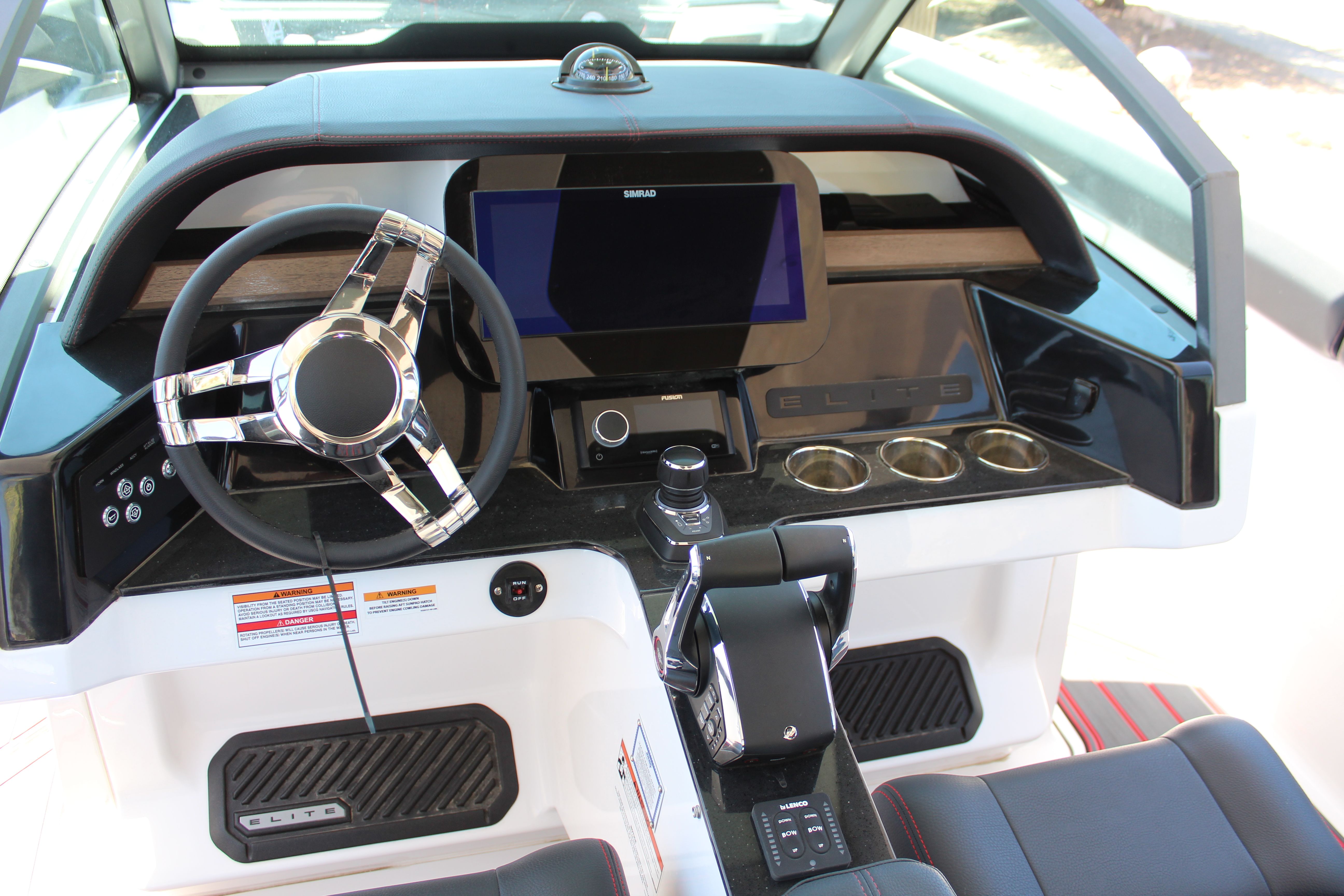 2025 Monterey Elite 30 OB cockpit with modern steering and display.