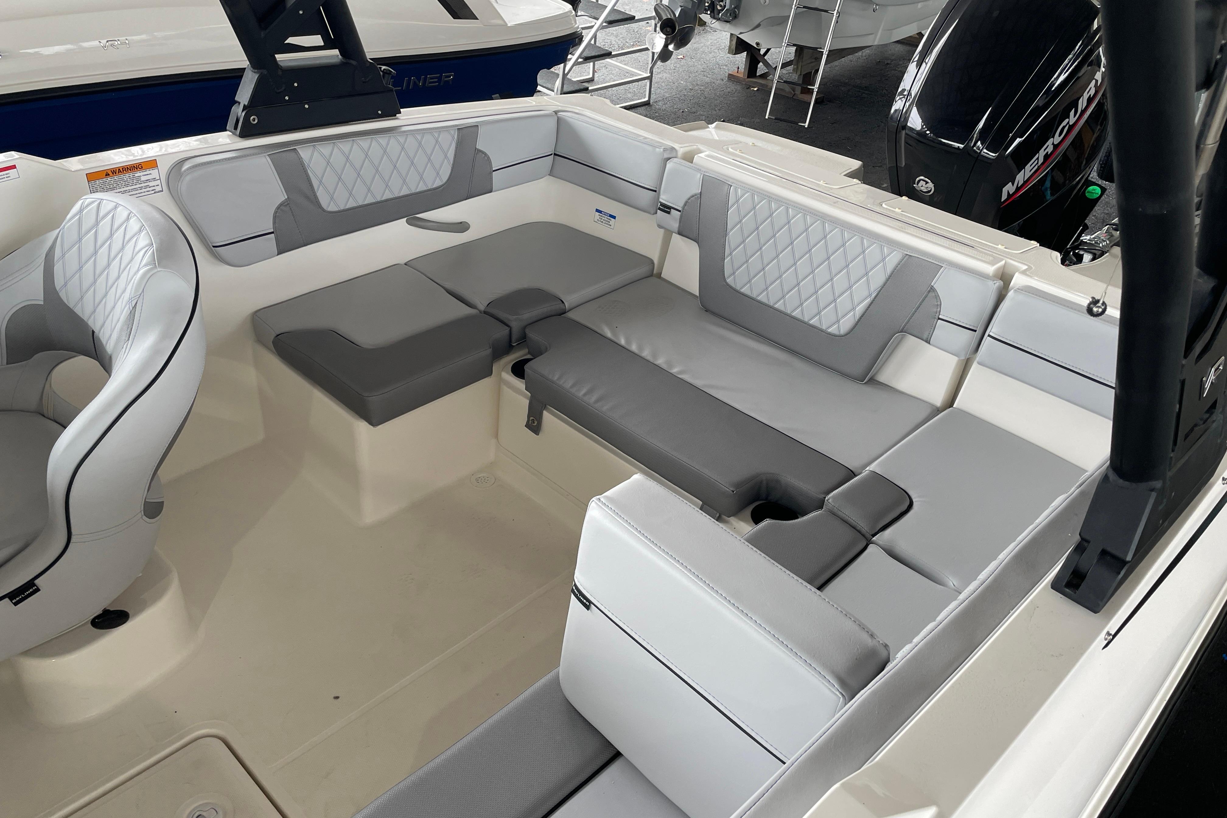 2026 Bayliner VR4 Bowrider OB interior with gray seating and modern design.