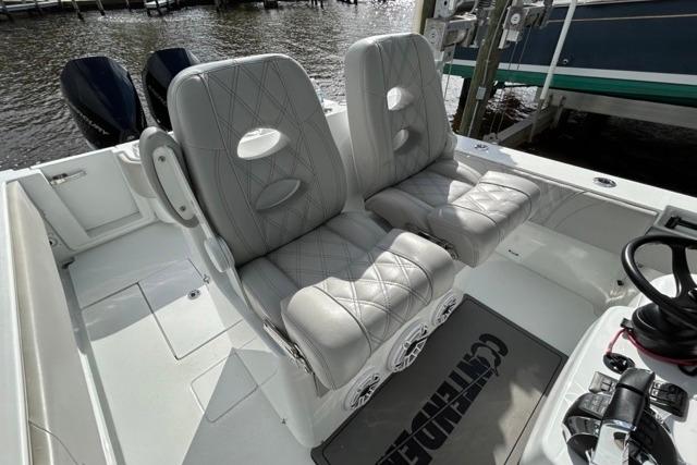 2023 Contender 32 ST boat interior with dual cushioned seats and steering wheel.