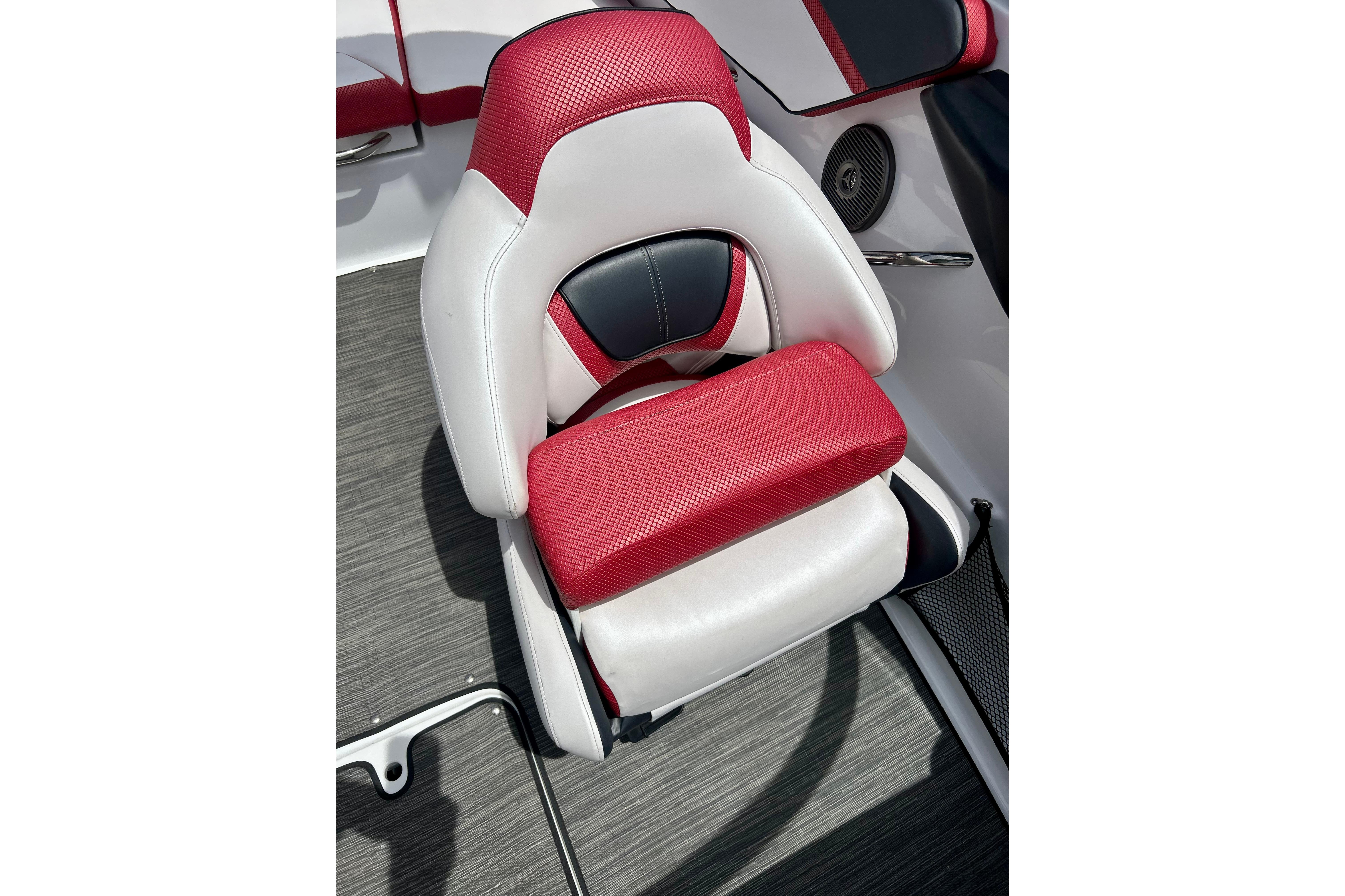 Red and white seat in 2021 Scarab 195 ID boat interior.