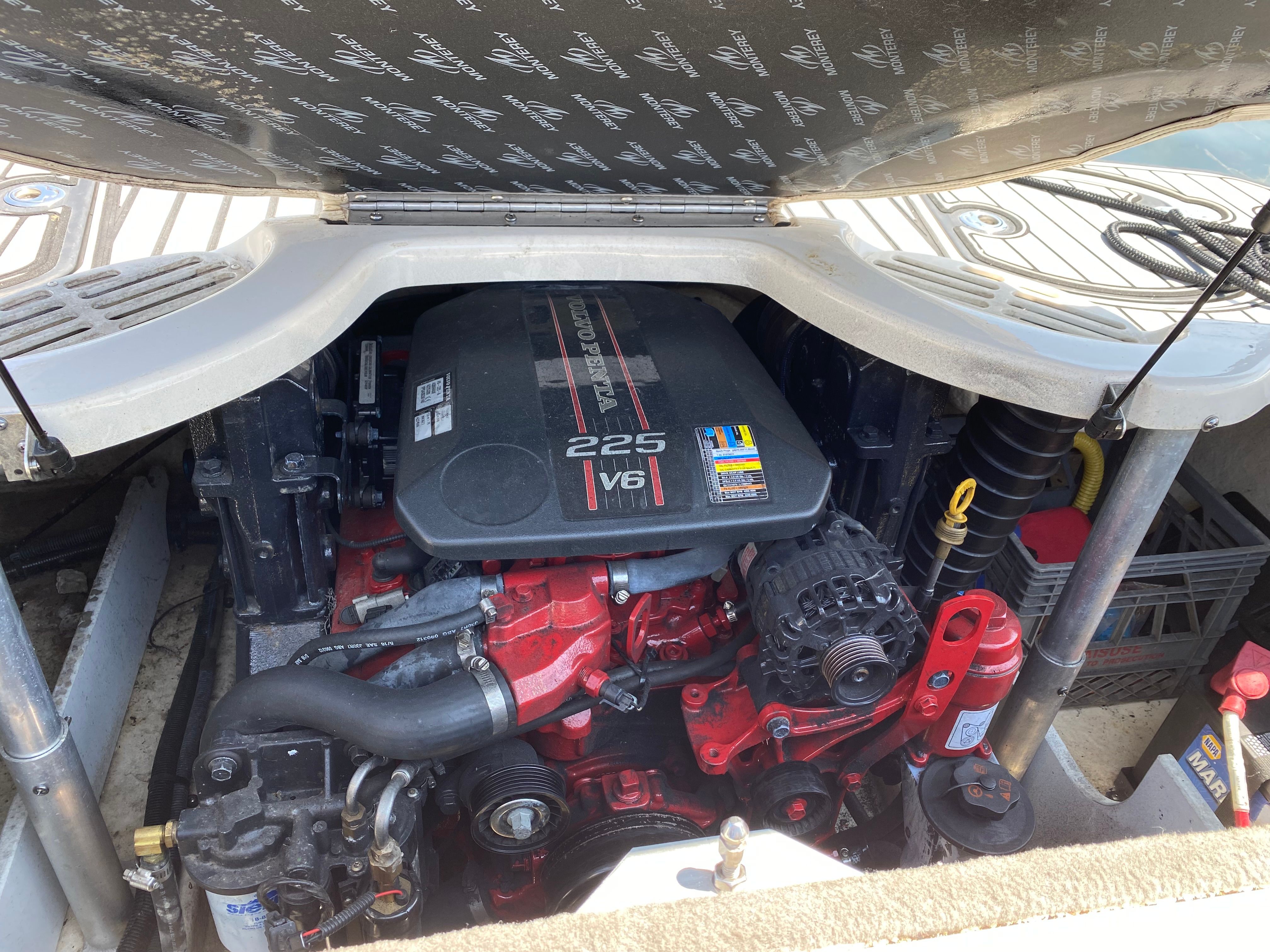 Engine compartment of 2013 Monterey 204FSX boat with Volvo Penta V6 engine.