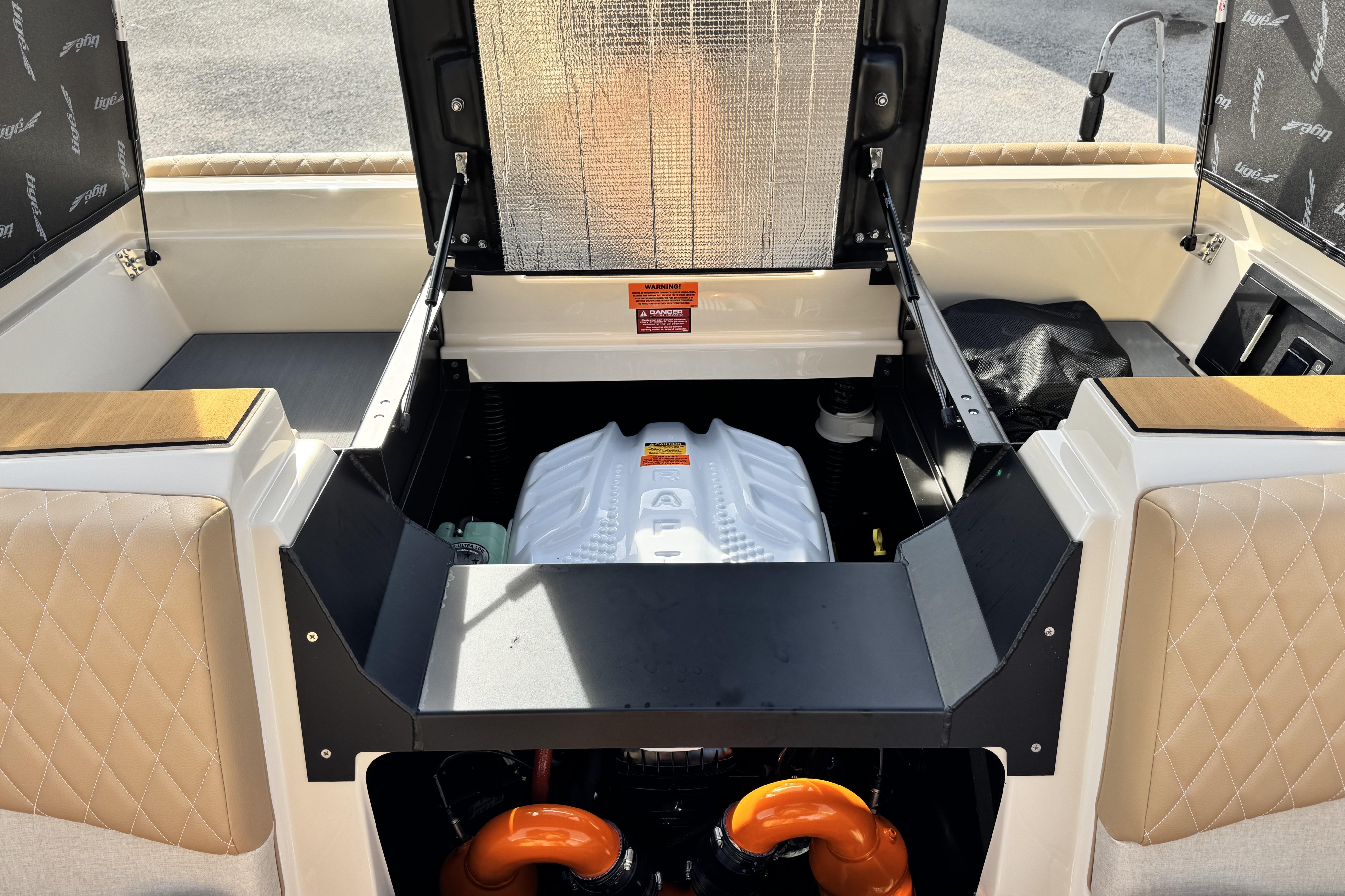 2026 Tigé Z3 boat engine compartment with open hatch, showcasing modern design and components.