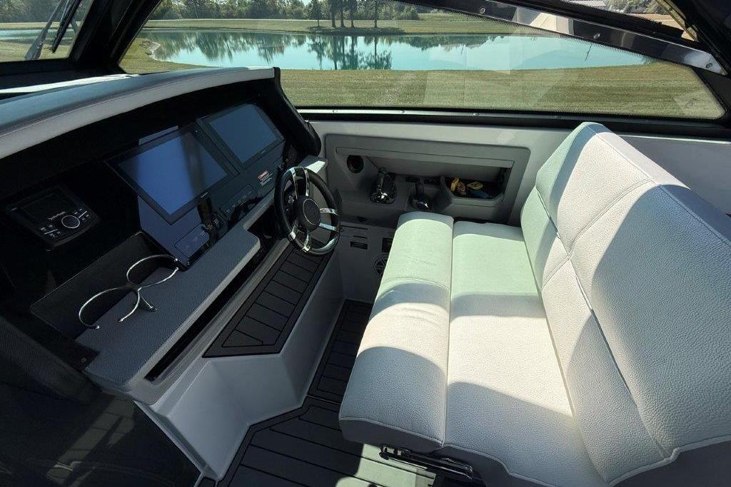 Interior of a 2019 Cobalt A36 boat with modern dashboard and comfortable seating.