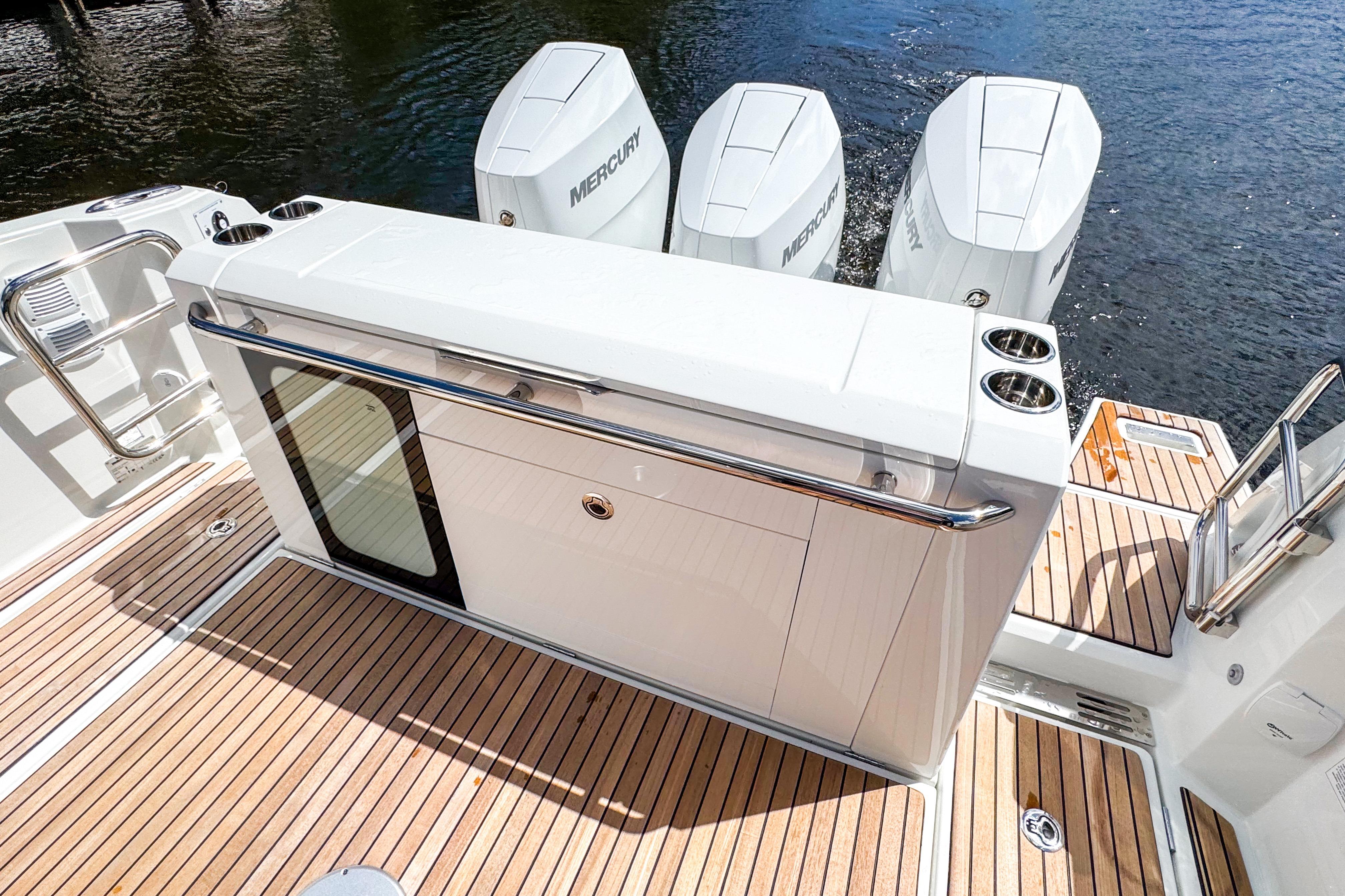 2025 Wellcraft 38 Explorer boat deck with Mercury engines and sleek design.